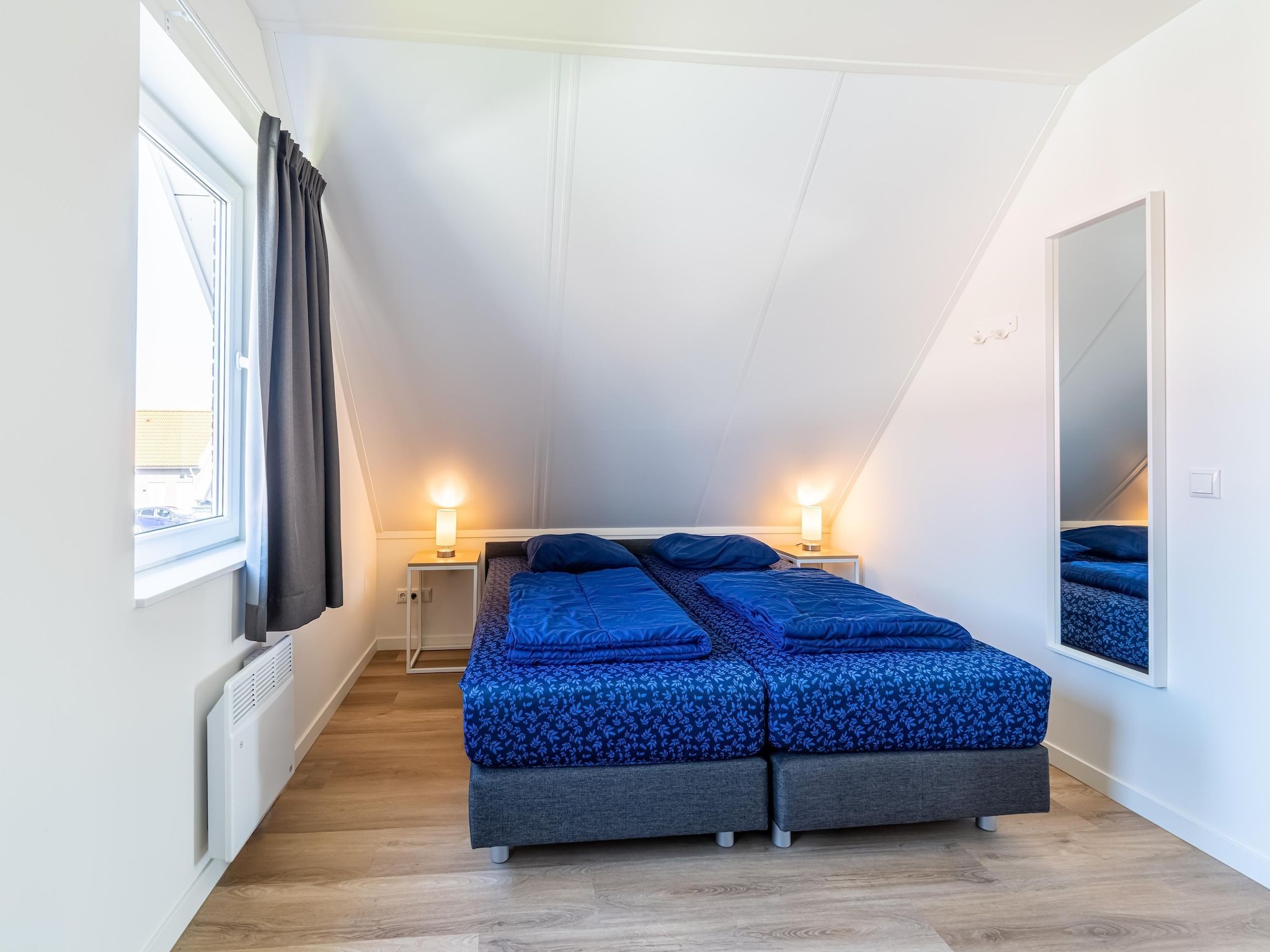 Een slaapkamer van Kuifduiker 138c in Simonshaven