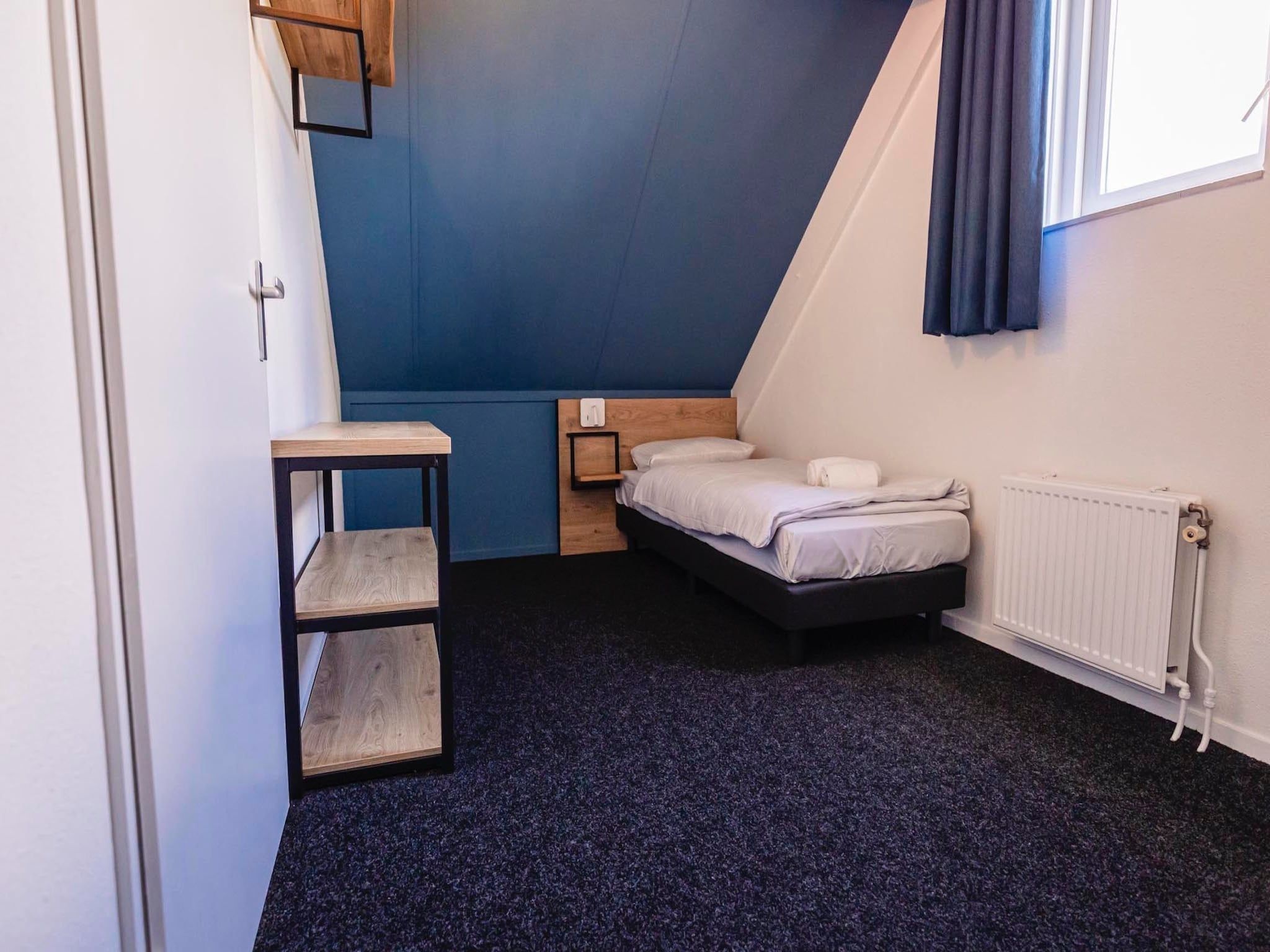 Een slaapkamer van Vakantiepark 't Broeckhuys 3 in Ewijk