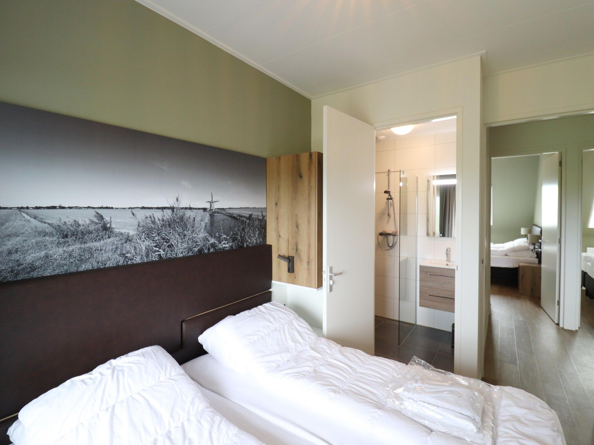 Een slaapkamer van Friese Villa 6 pers met sloep optioneel bij te boeken in Leons