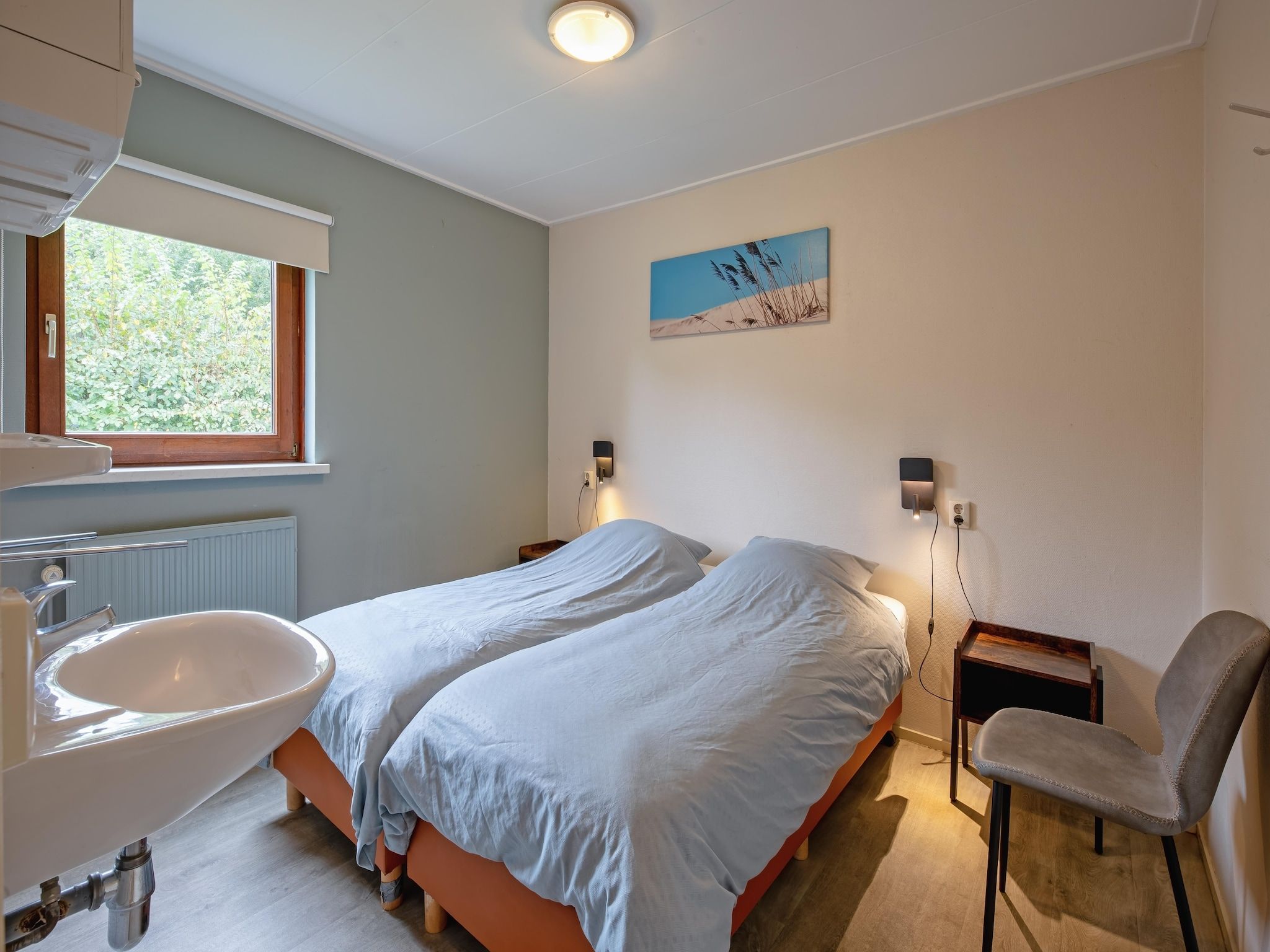 Een slaapkamer van De Parel 166 in Den Burg