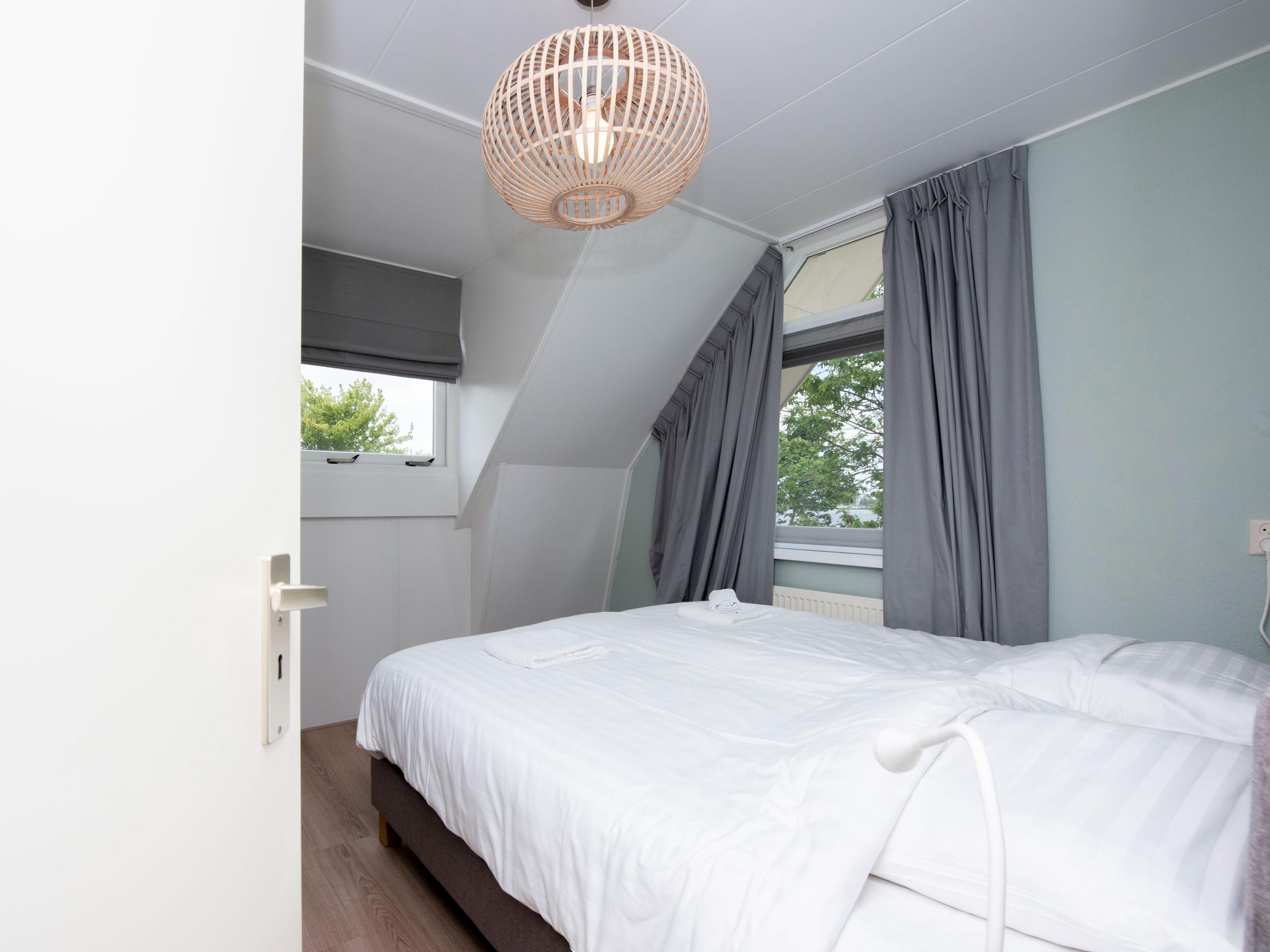 Een slaapkamer van Villa aan het water in Terherne in Terherne
