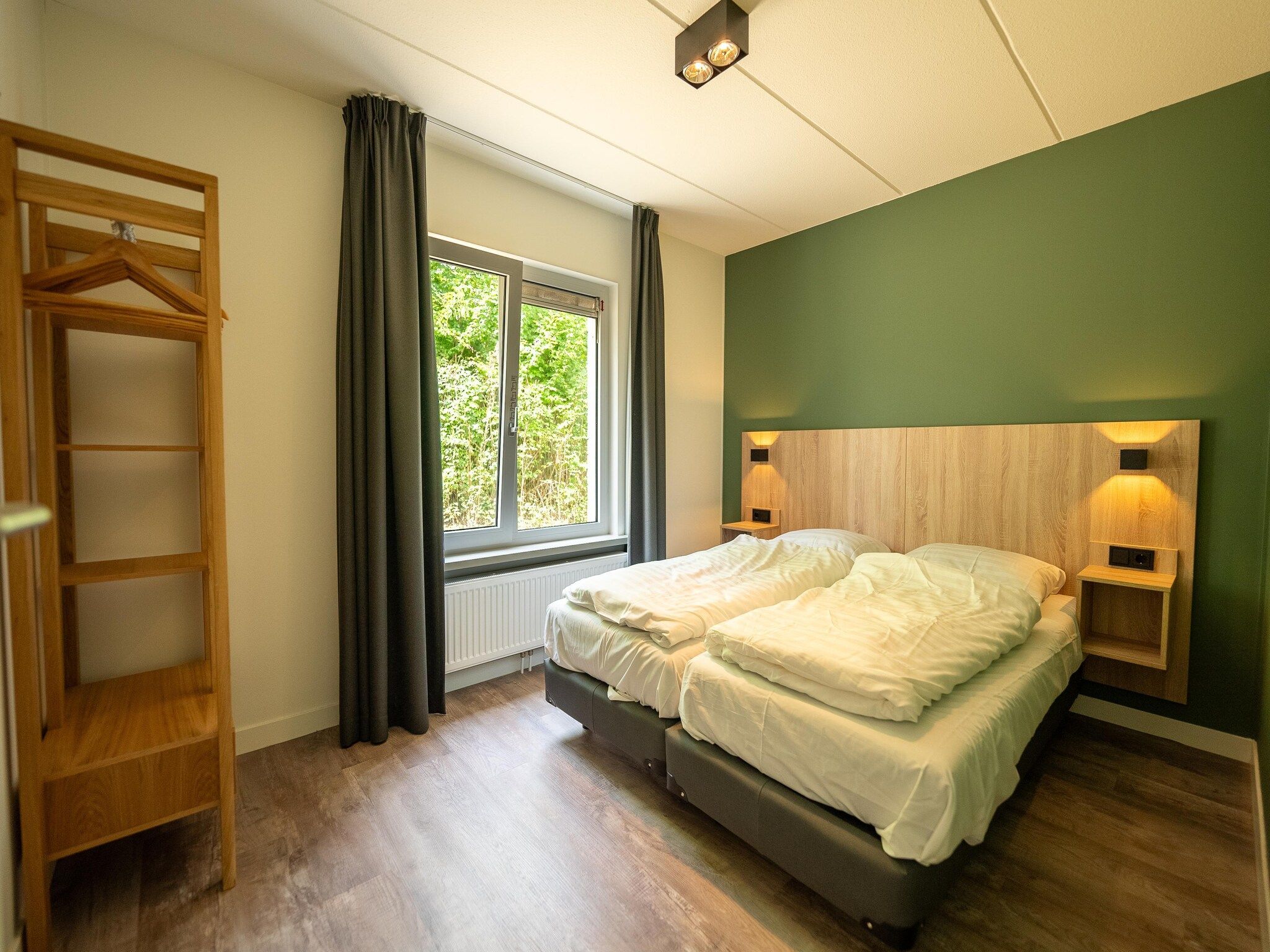 Een slaapkamer van Vakantiepark Hunzedal 18 in Borger