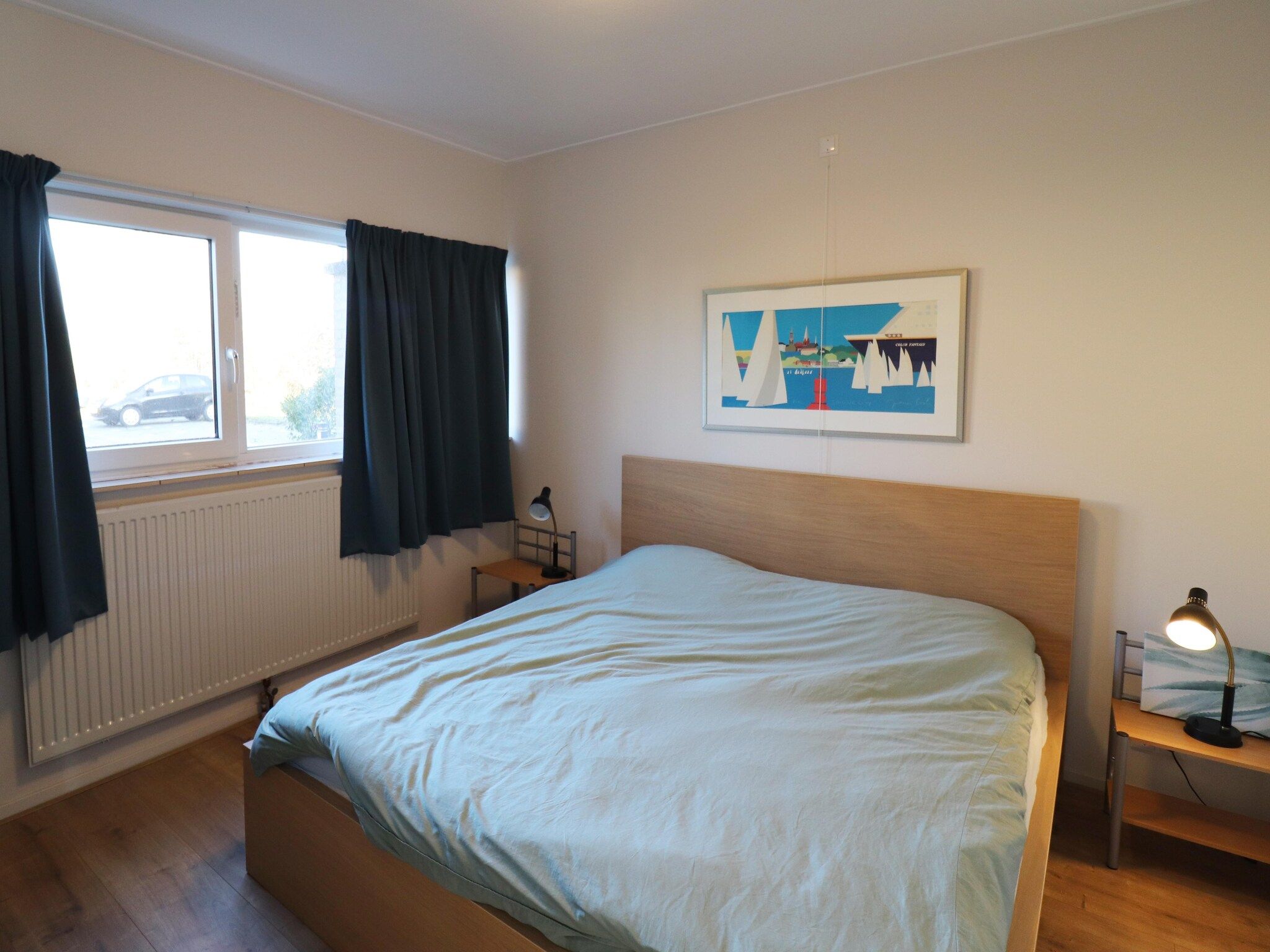 Een slaapkamer van Appartement aan het meer in Heeg in Heeg