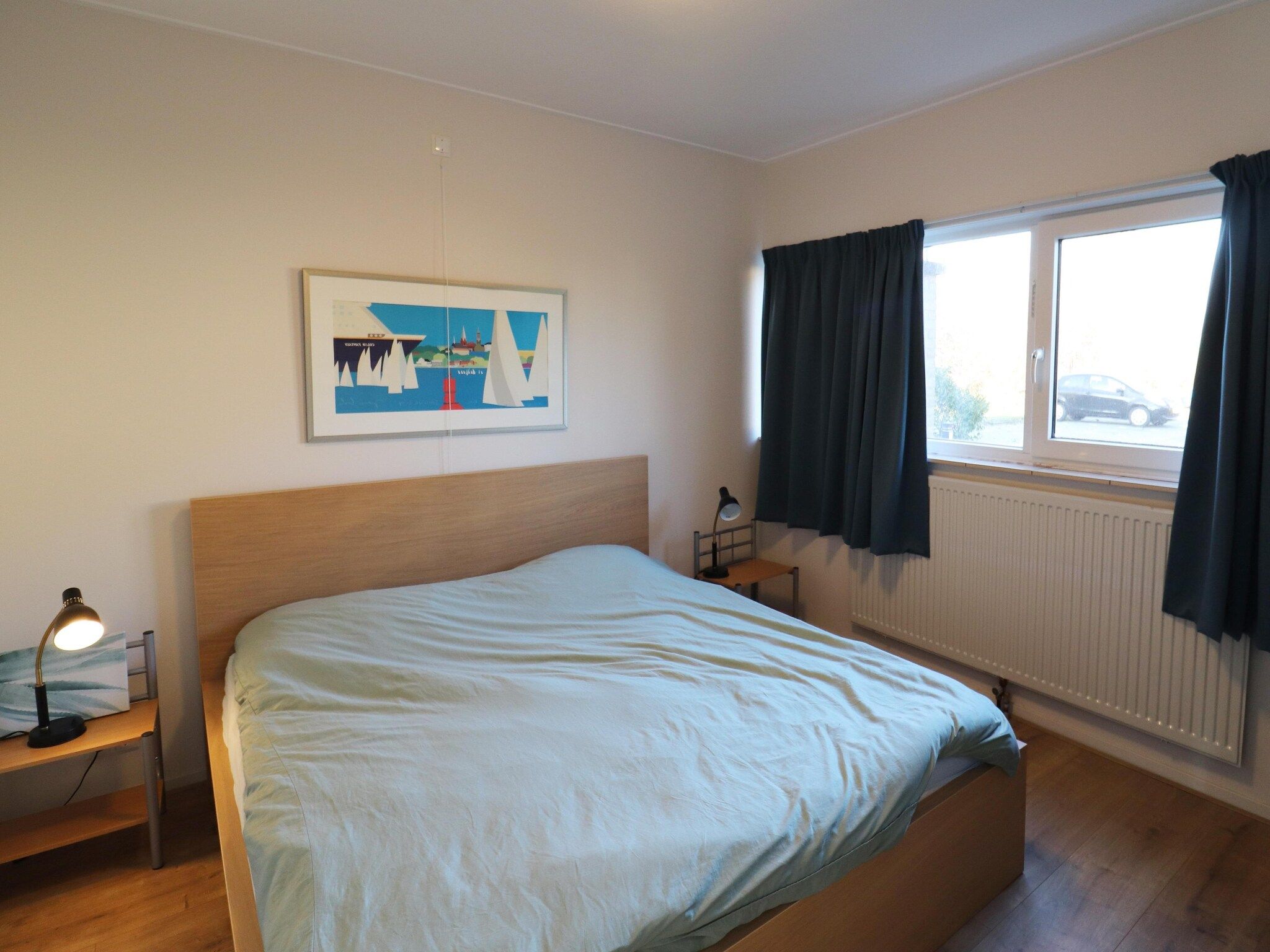 Een slaapkamer van Appartement aan het meer in Heeg in Heeg