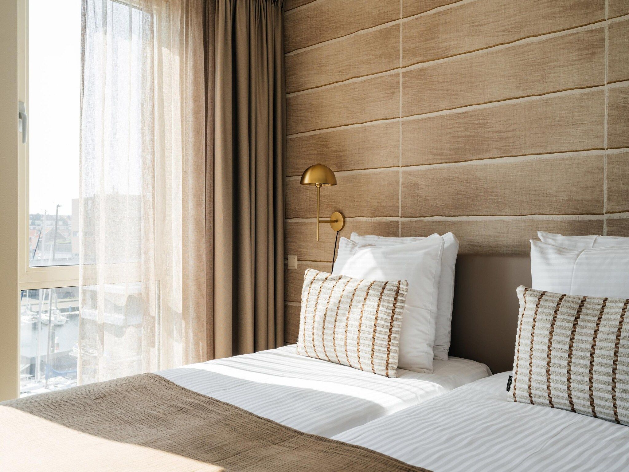 Een slaapkamer van Scheveningen Harbour 30A in Den Haag