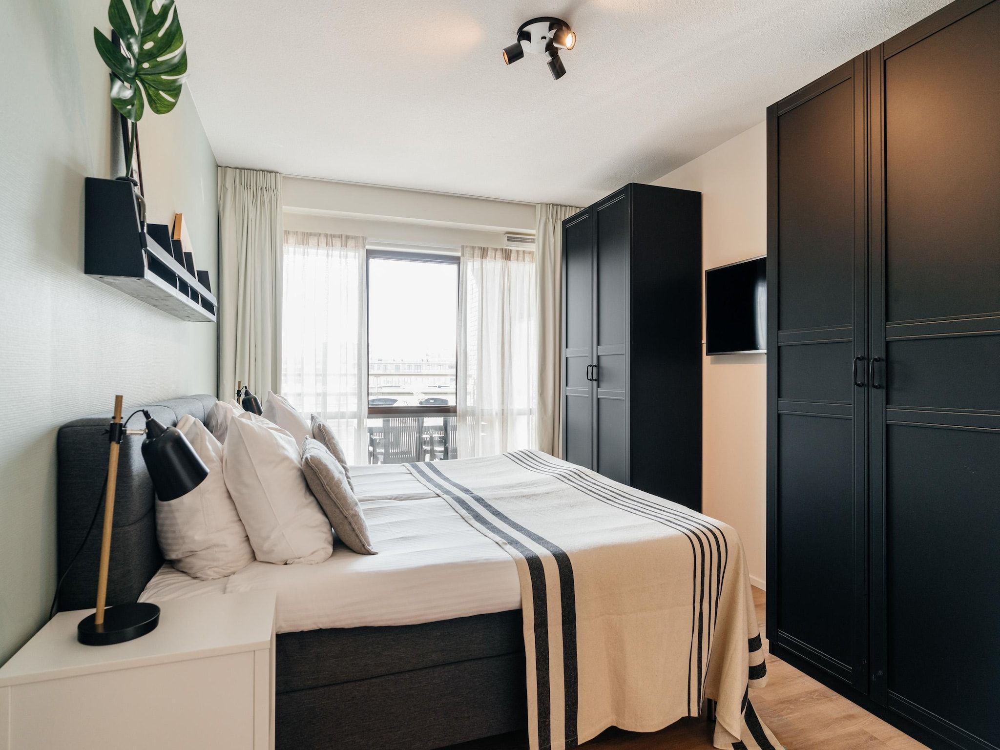 Een slaapkamer van Scheveningen Harbour 80B in Scheveningen