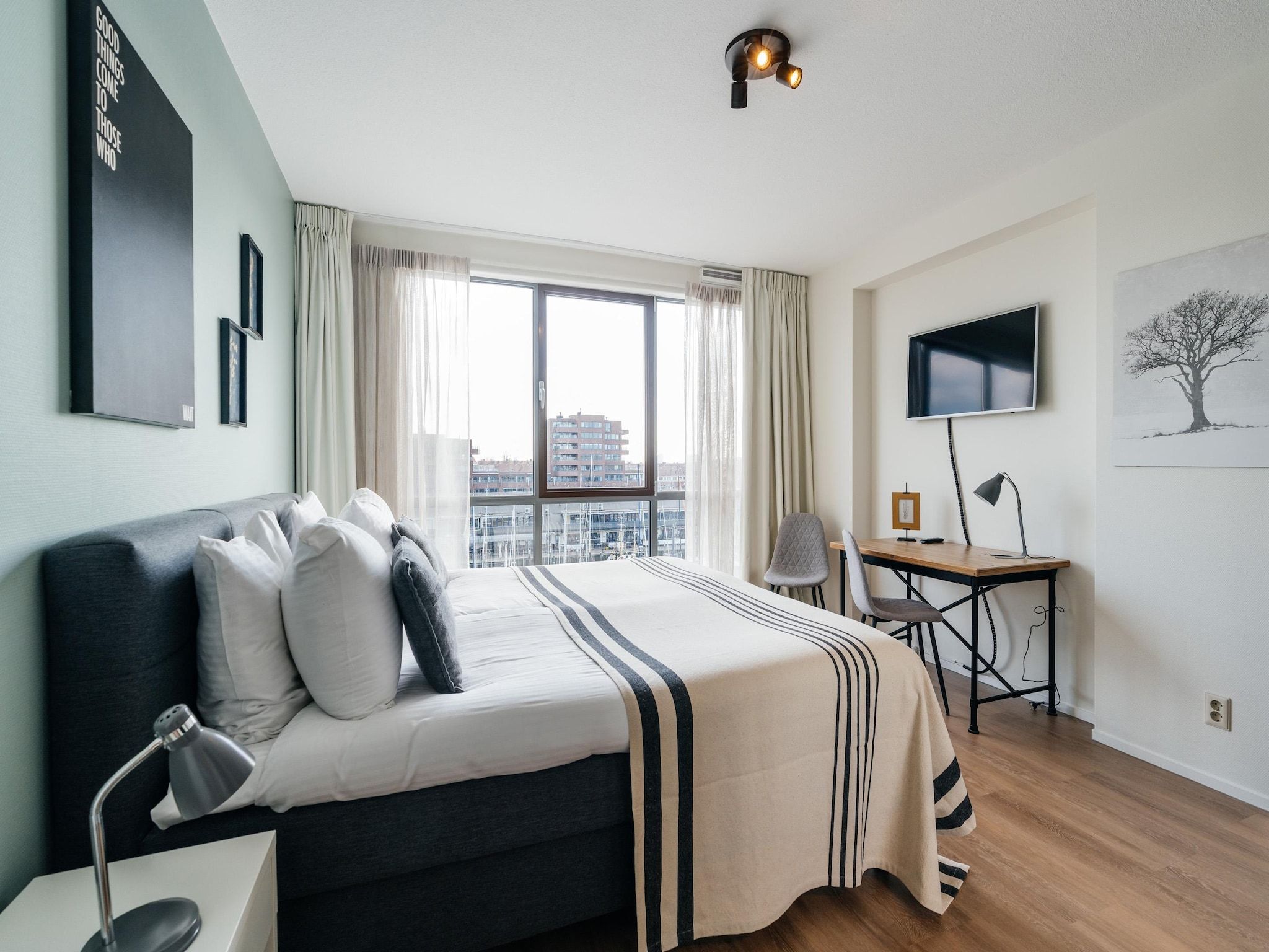 Een slaapkamer van Scheveningen Harbour 80B in Scheveningen