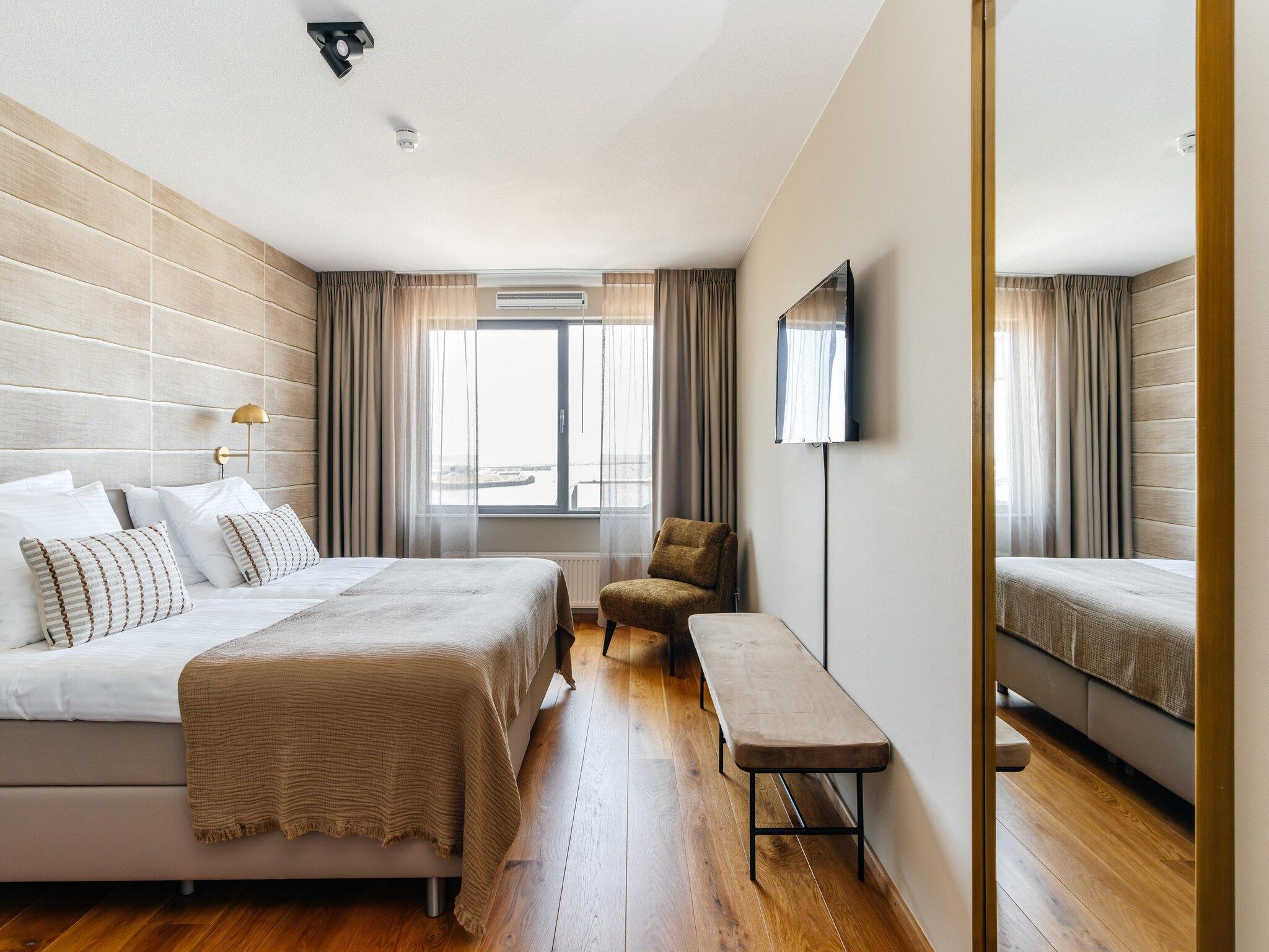 Een slaapkamer van Scheveningen Harbour 40A in Den Haag