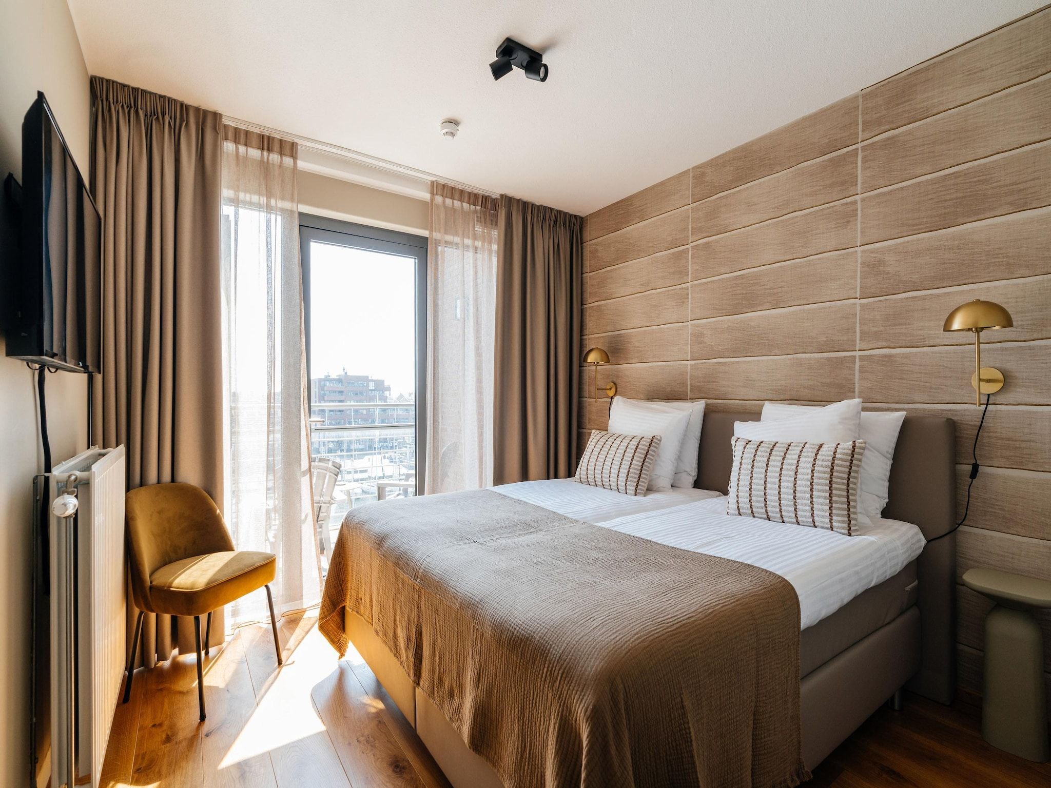 Een slaapkamer van Scheveningen Harbour 40B in Den Haag
