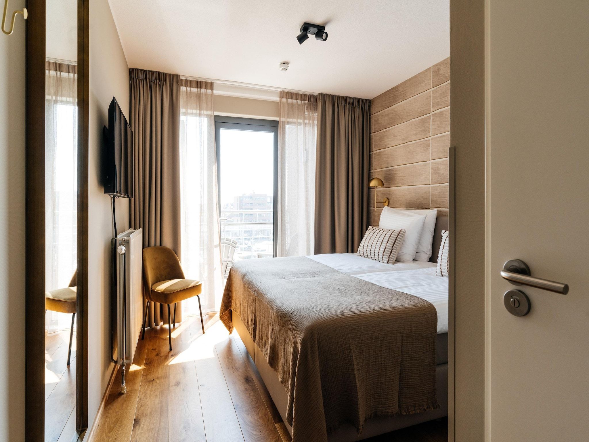 Een slaapkamer van Scheveningen Harbour 40B in Den Haag