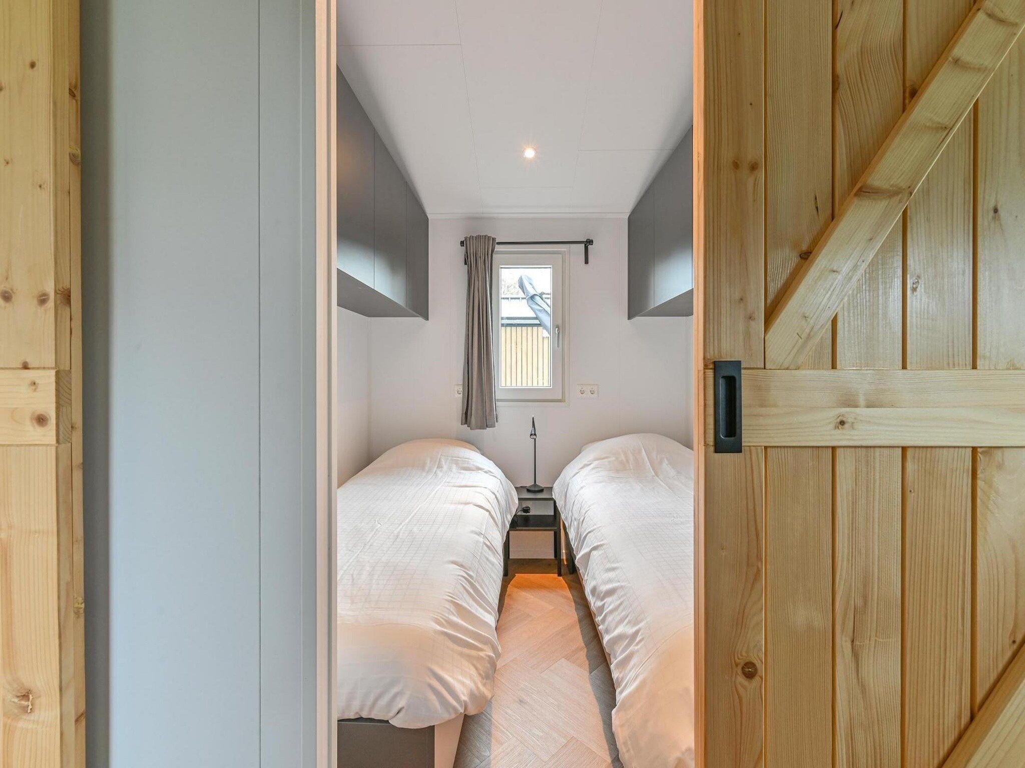 Een slaapkamer van Resort Drentse Weelde 1 in Hoogersmilde