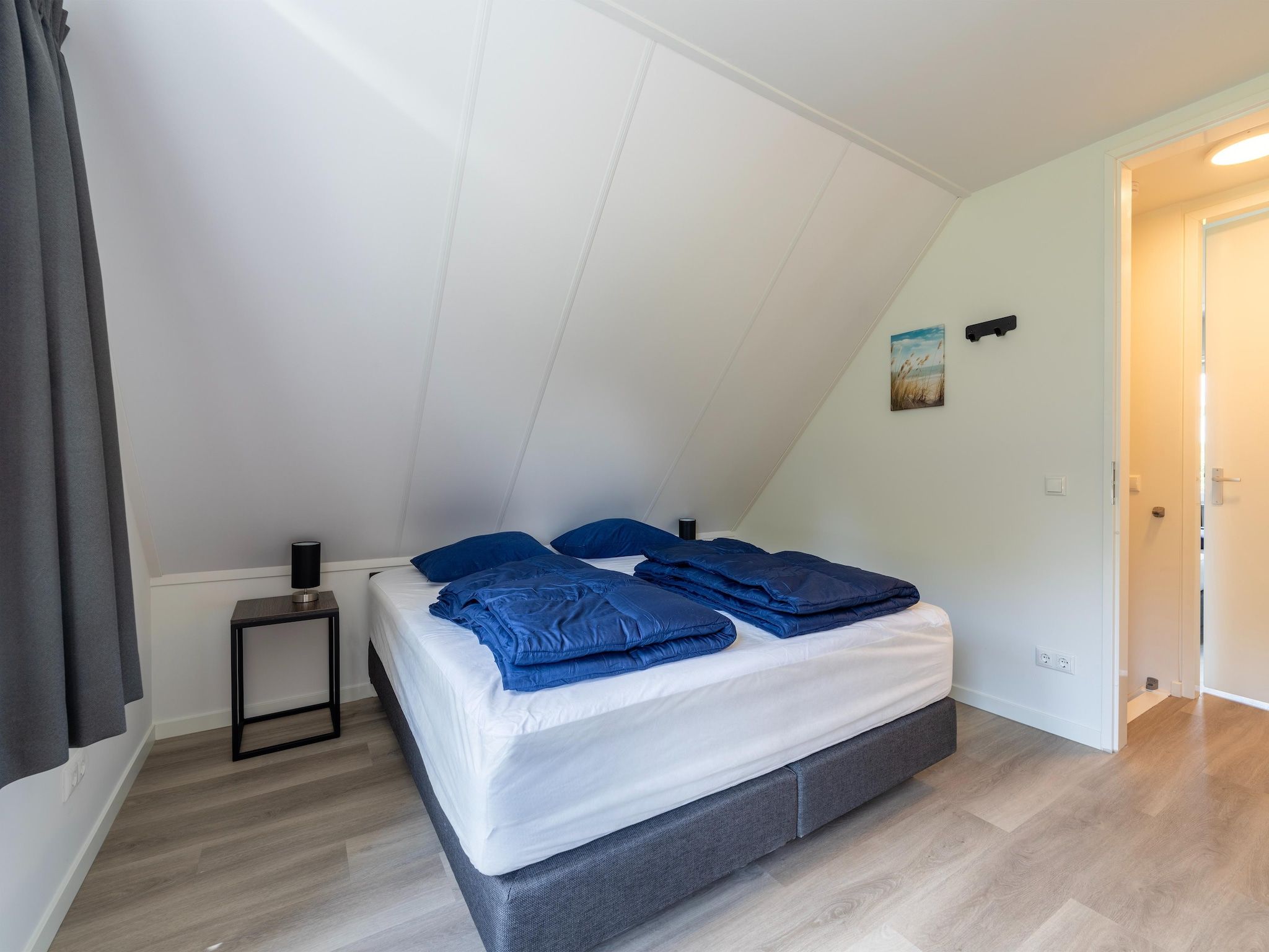 Een slaapkamer van Kuifduiker 3 in Simonshaven