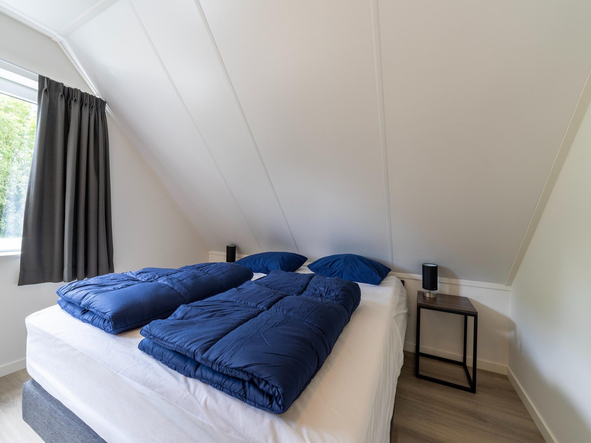 Een slaapkamer van Kuifduiker 3 in Simonshaven