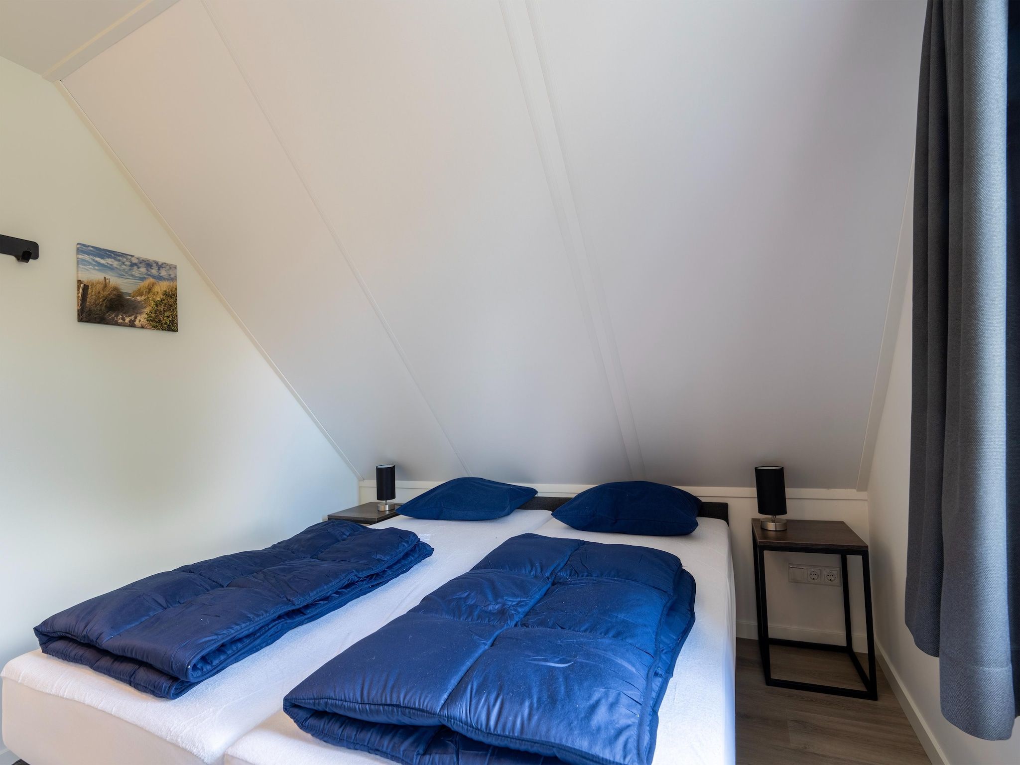 Een slaapkamer van Kuifduiker 3 in Simonshaven