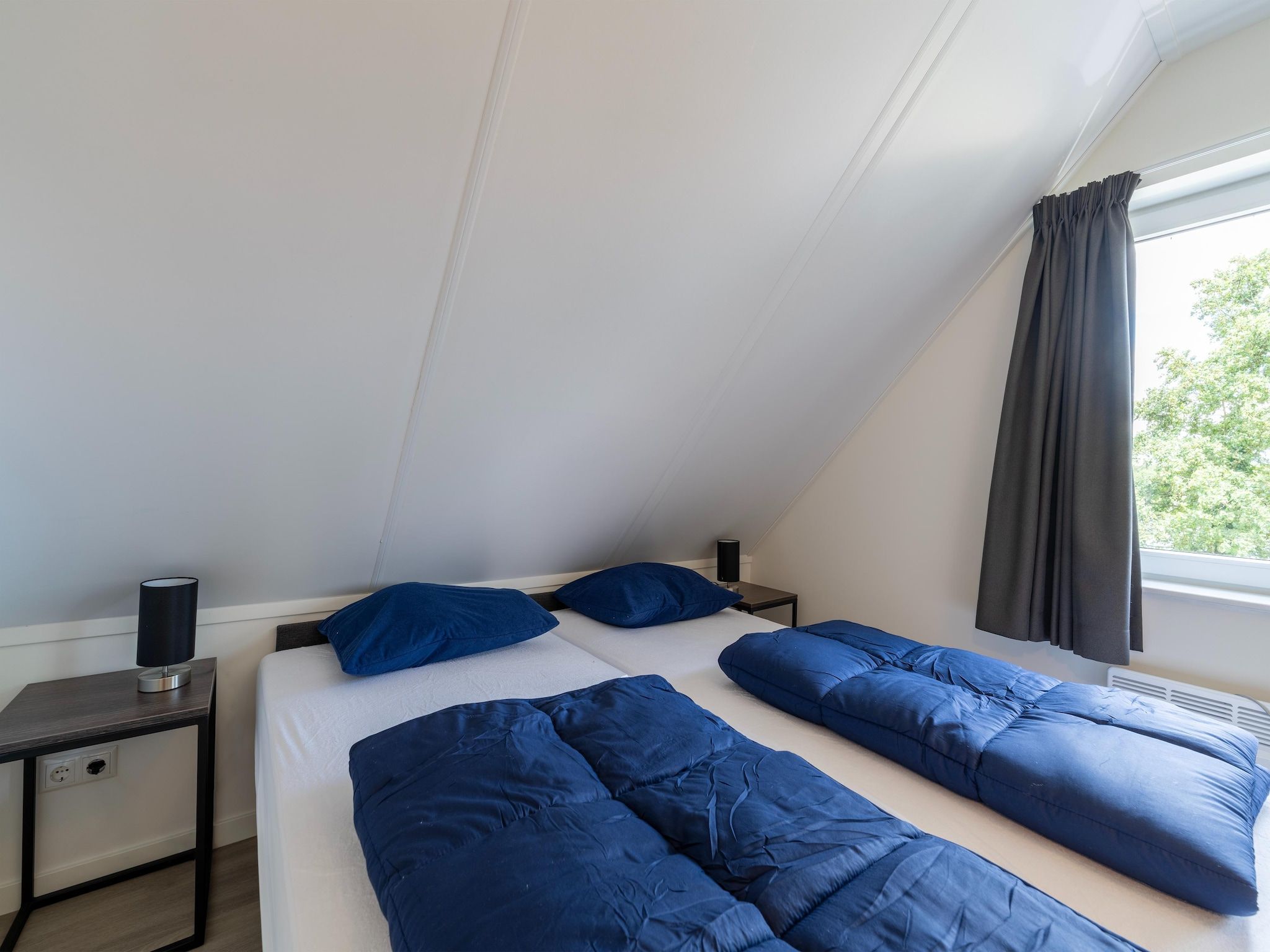 Een slaapkamer van Kuifduiker 3 in Simonshaven