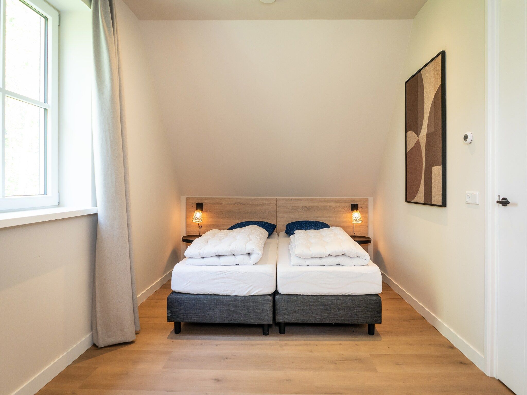 Een slaapkamer van So What 33A in De Koog