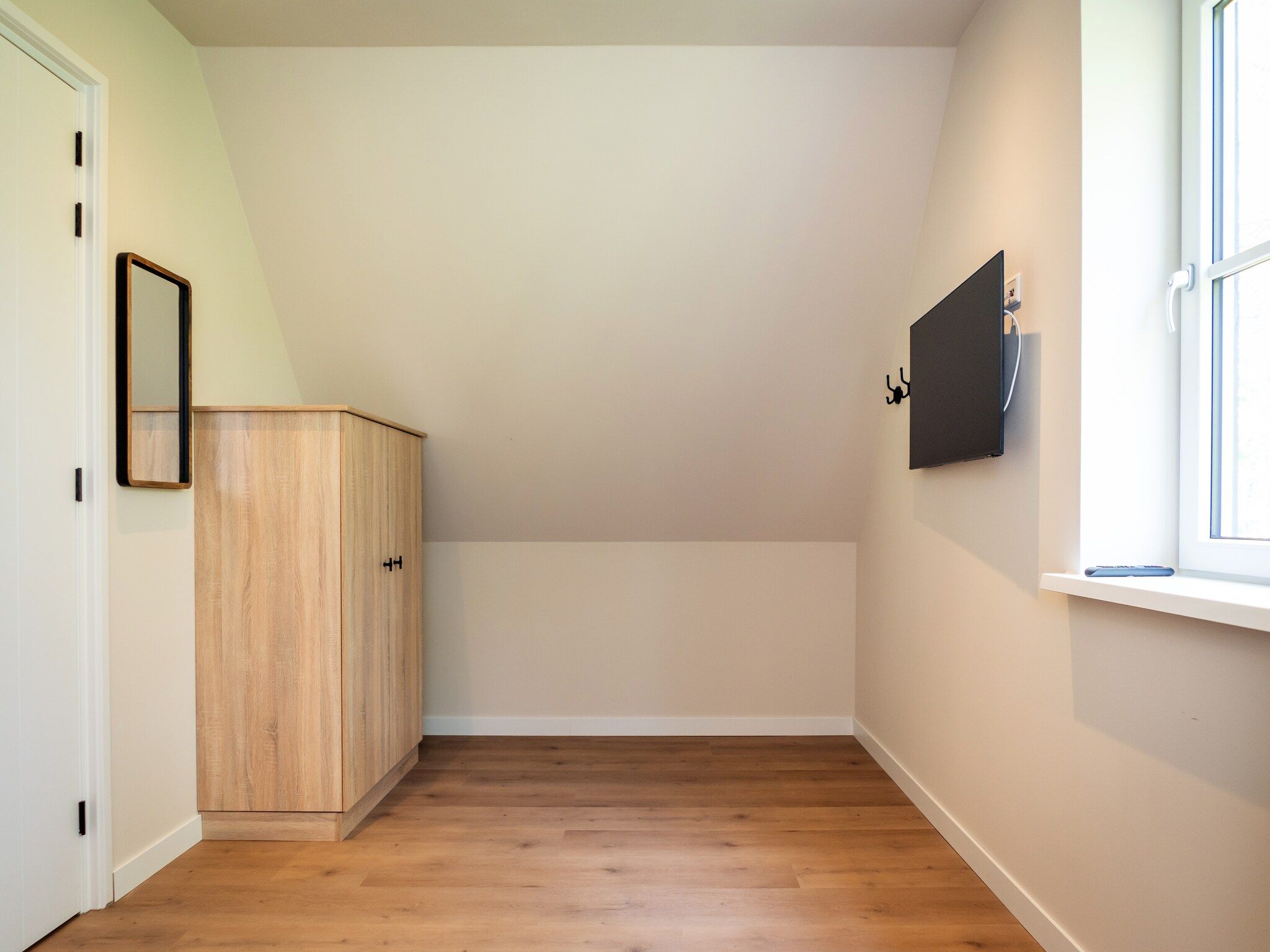 Een slaapkamer van So What 33A in De Koog