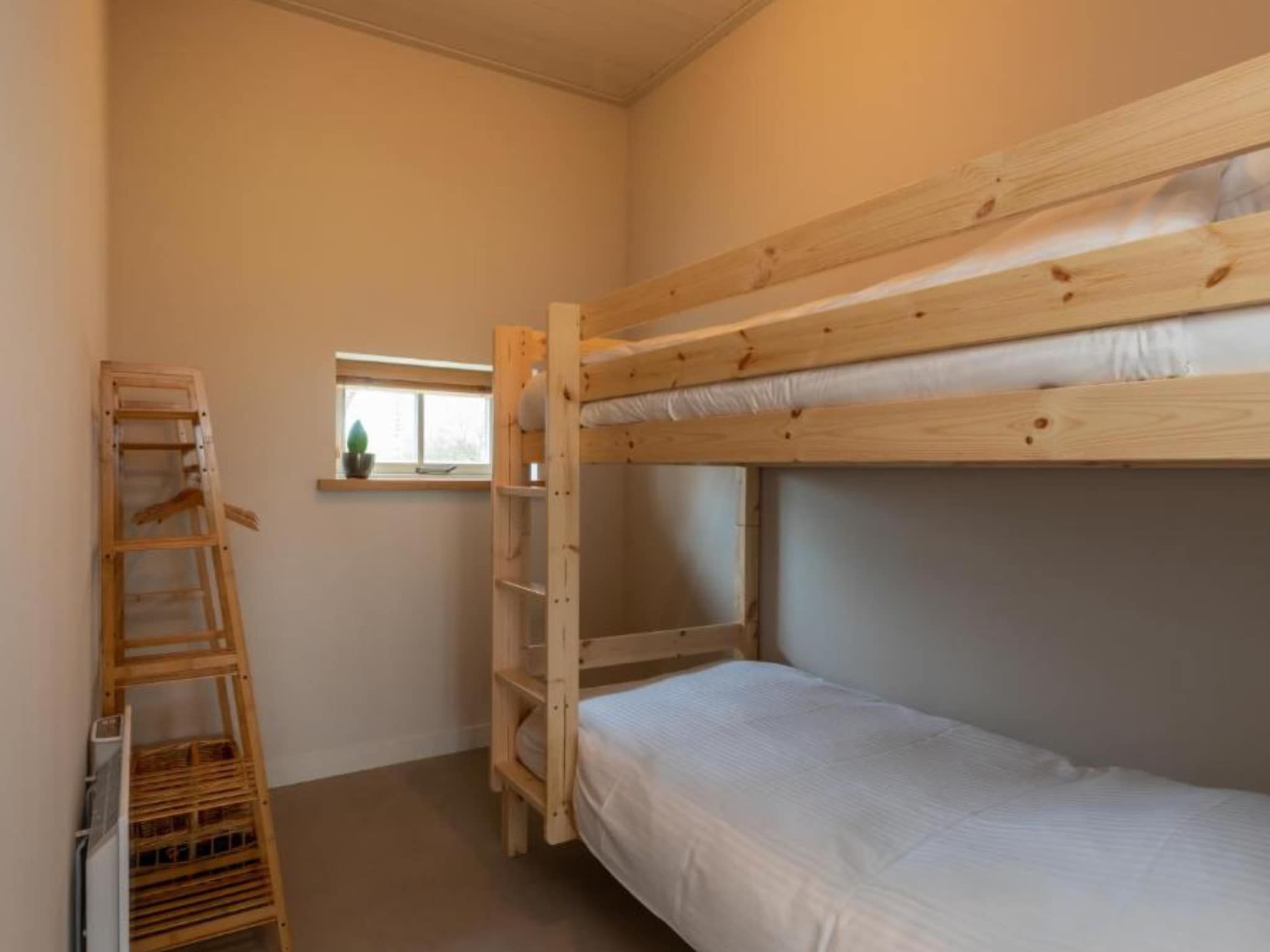 Een slaapkamer van Grijpskerke 'De kleine Pionier' in Grijpskerke
