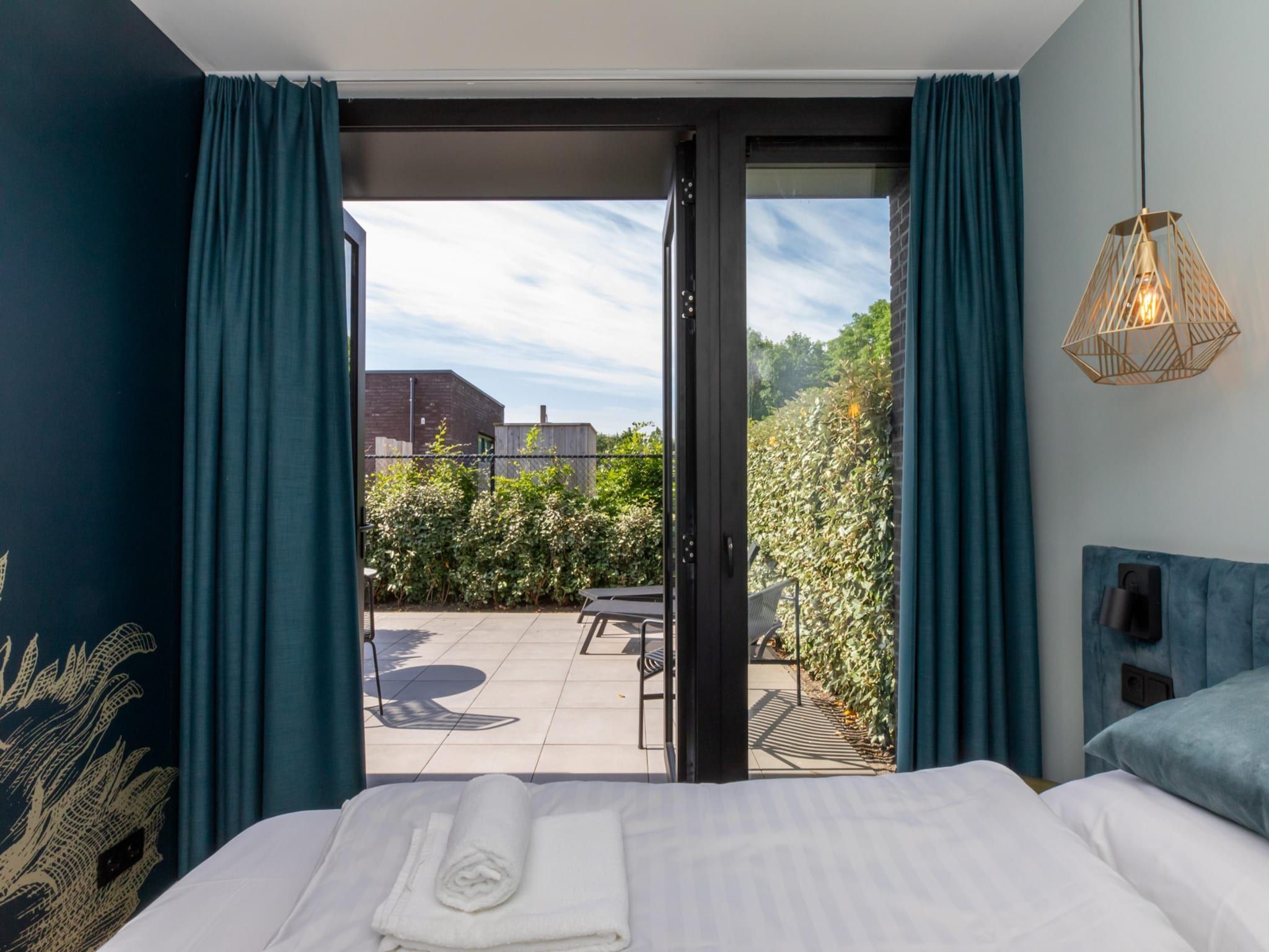 Een slaapkamer van Vakantiewoning ZEEBRIES in Koudekerke