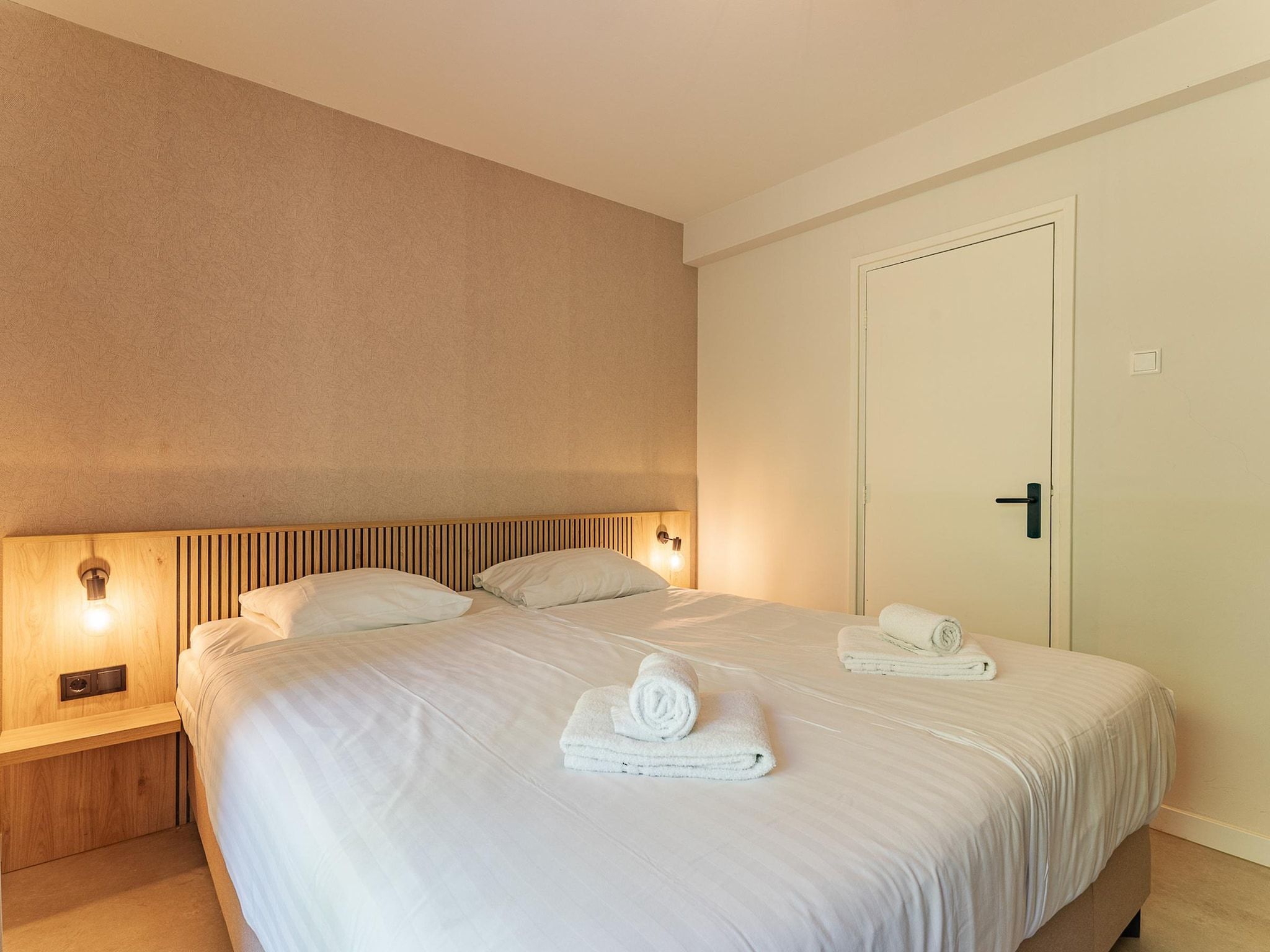 Een slaapkamer van Nieuwstraat 1  Zoutelande 'Kurhaus - 4 met sauna in Zoutelande