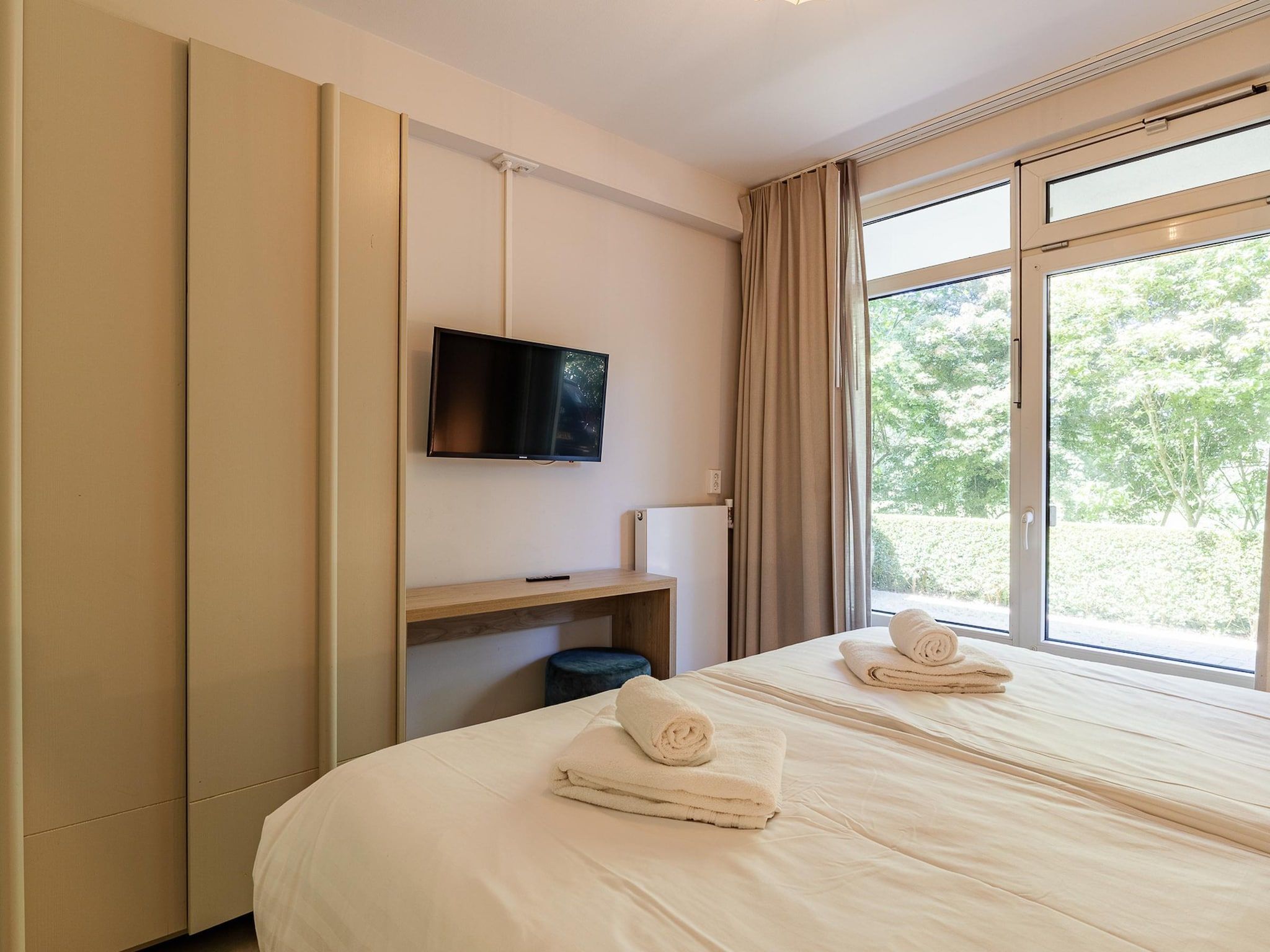 Een slaapkamer van Nieuwstraat 1  Zoutelande 'Kurhaus - 4 met sauna in Zoutelande