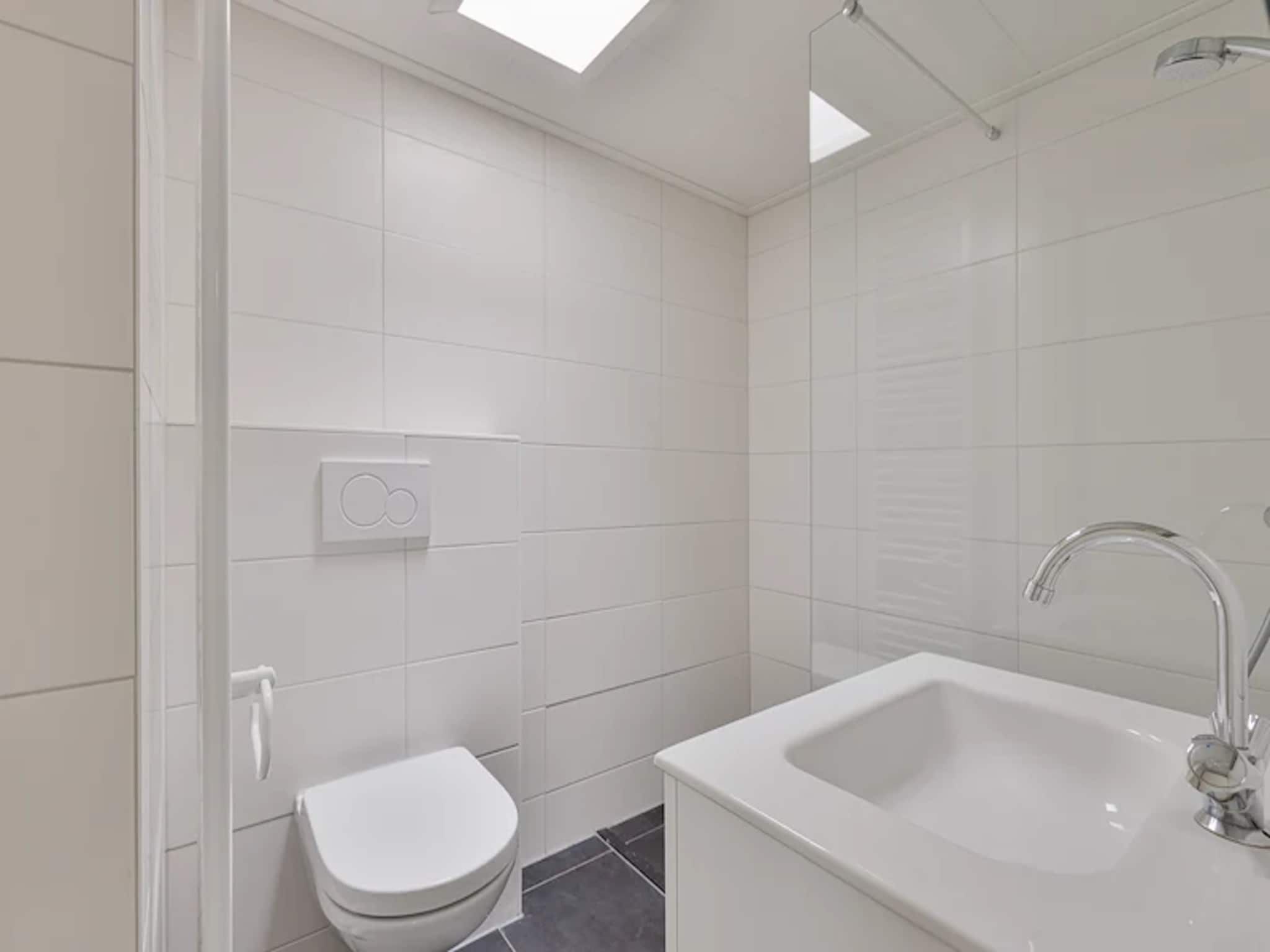 De badkamer van Vakantiepark de Berkenhorst 13 in Kootwijk