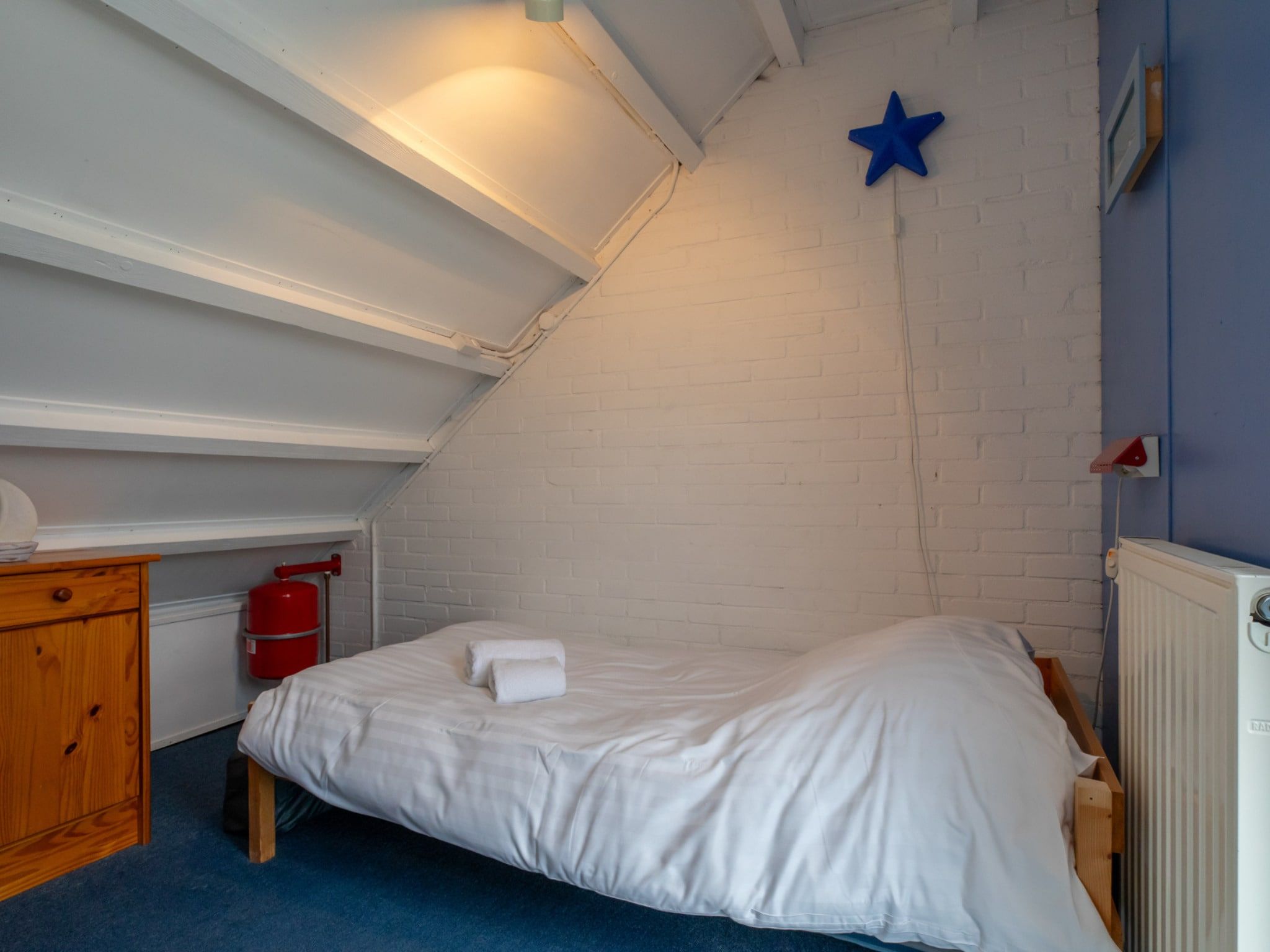 Een slaapkamer van De Haaijmanweg 5  Burgh Haamstede 'Huisje 86' in Burgh-Haamstede