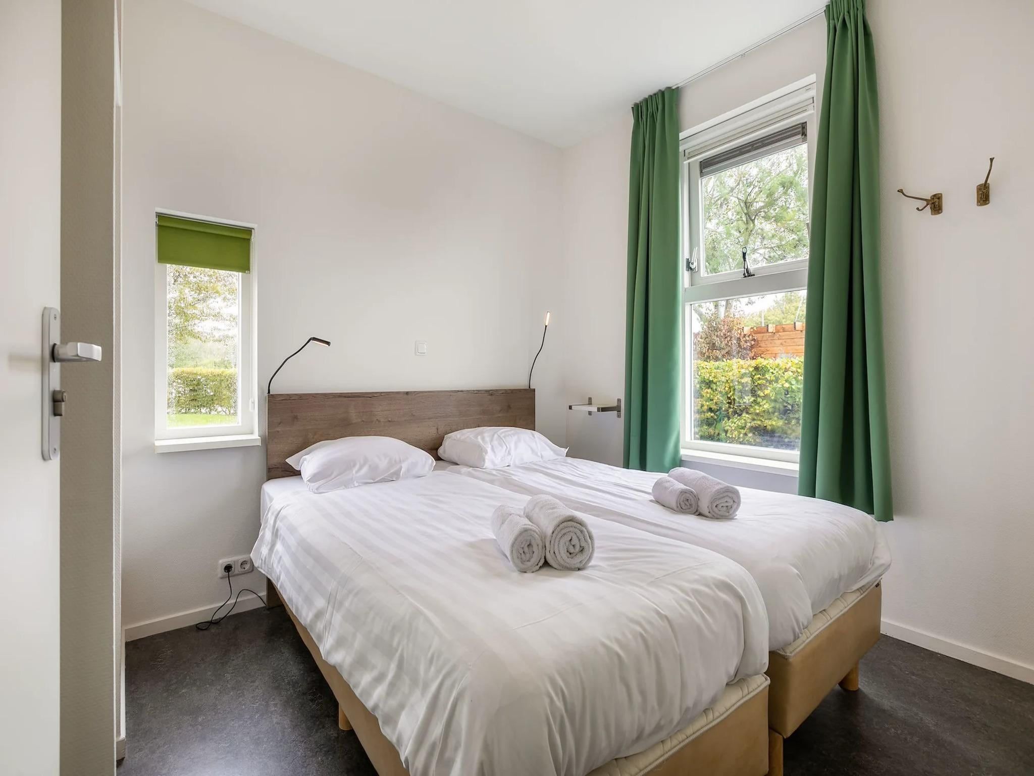 Een slaapkamer van Havenresort Terherne 3 in Terherne