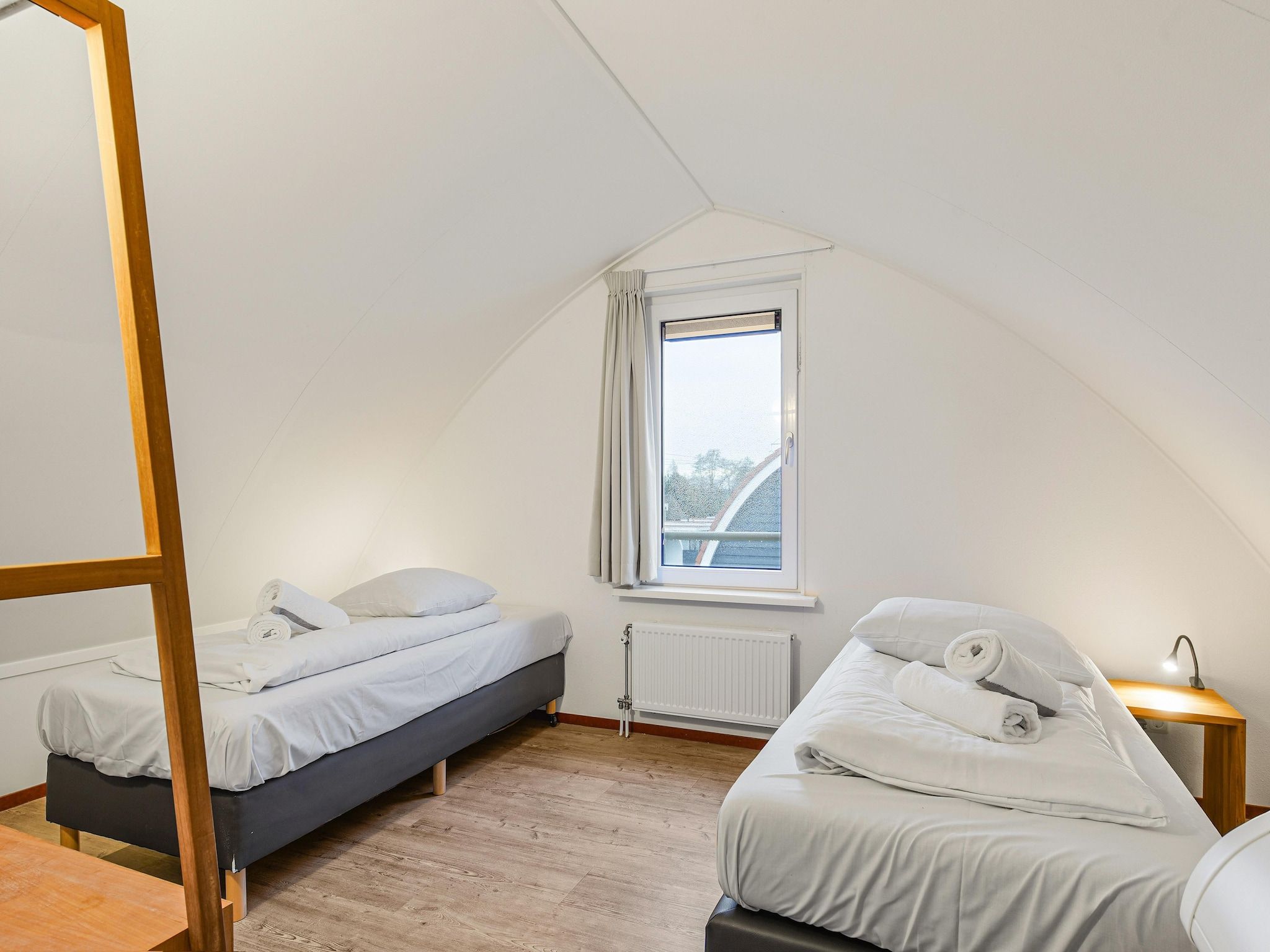 Een slaapkamer van Waterpark De Bloemert 1 in Midlaren