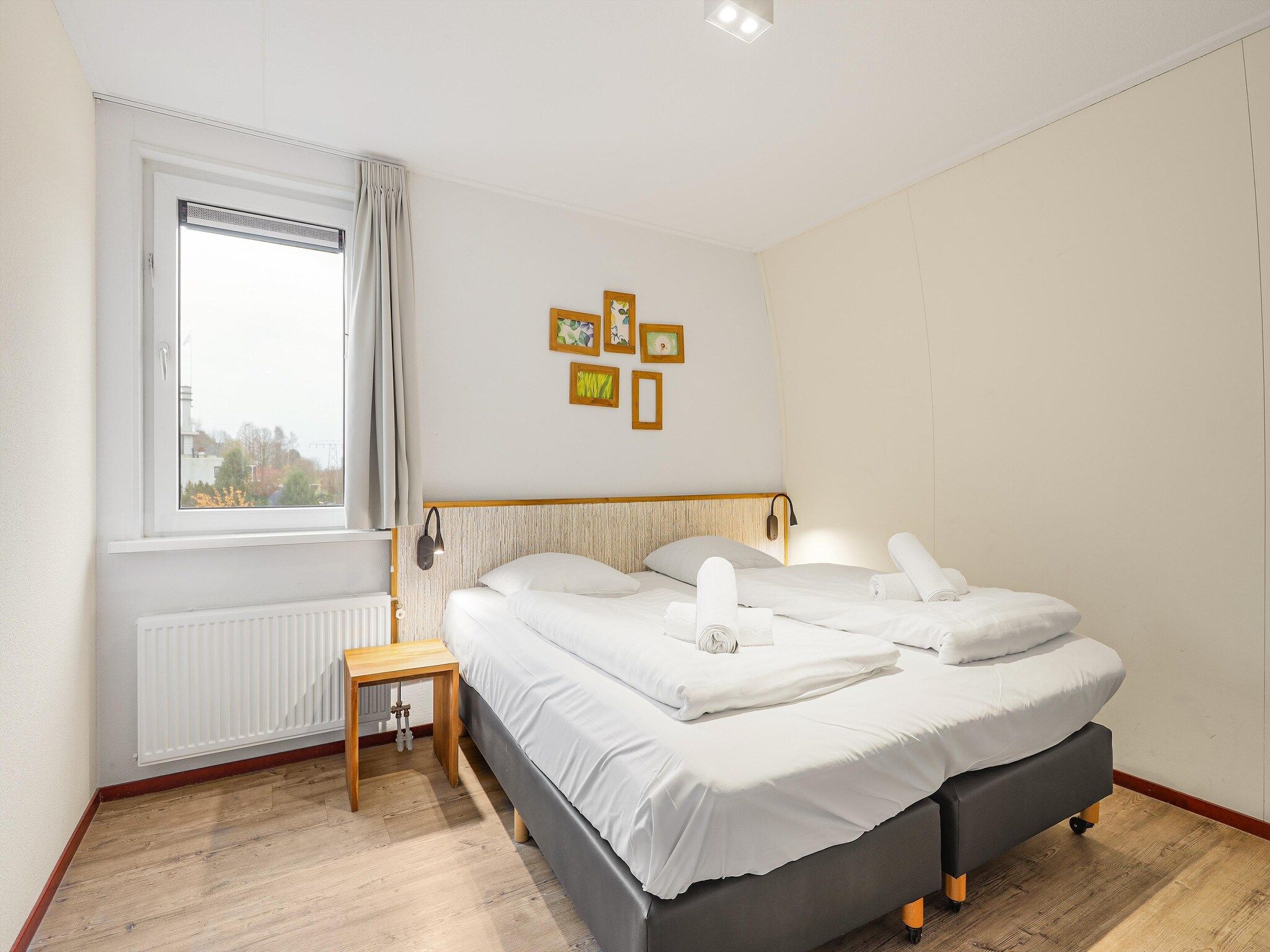 Een slaapkamer van Waterpark De Bloemert 2 in Midlaren