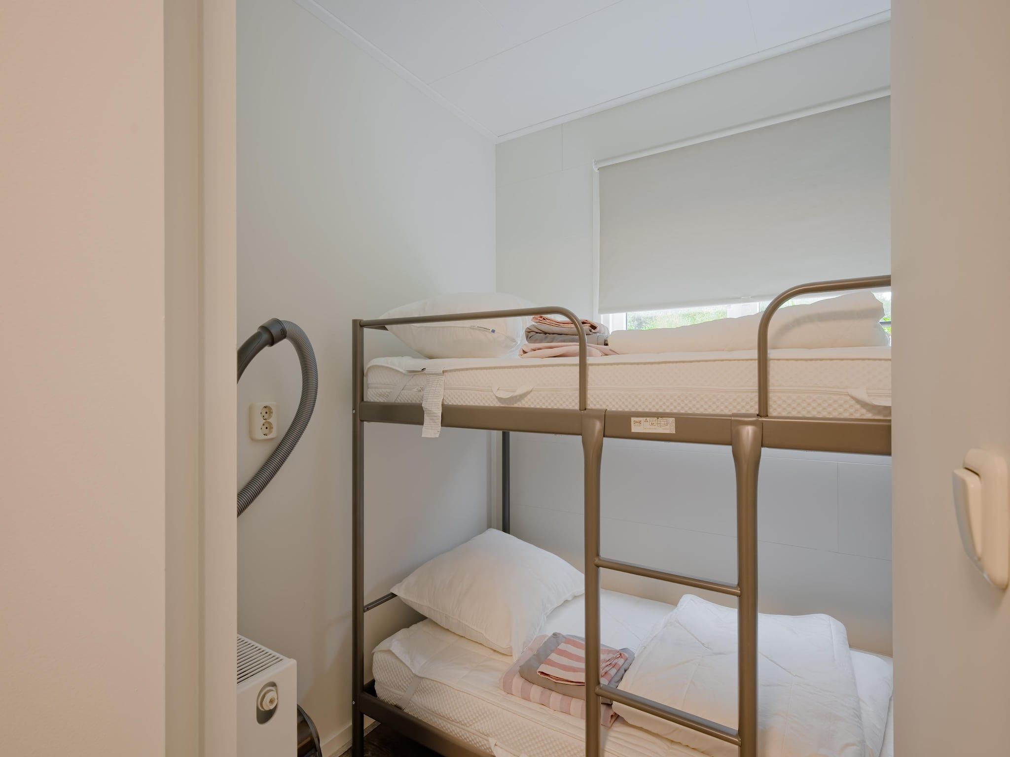 Een slaapkamer van Chalet 56 stegeren in Stegeren