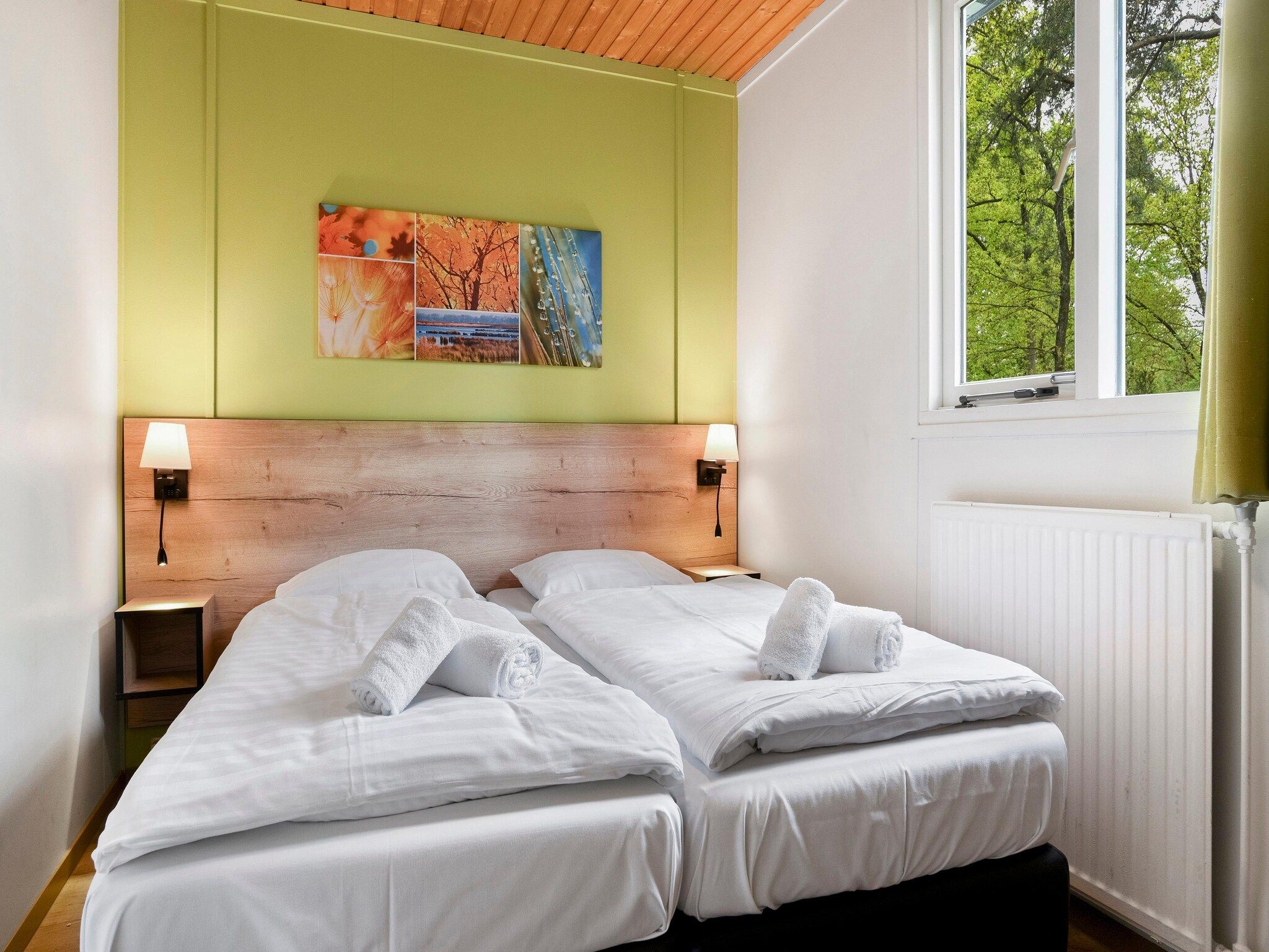 Een slaapkamer van Parc Heihaas 4 in Putten