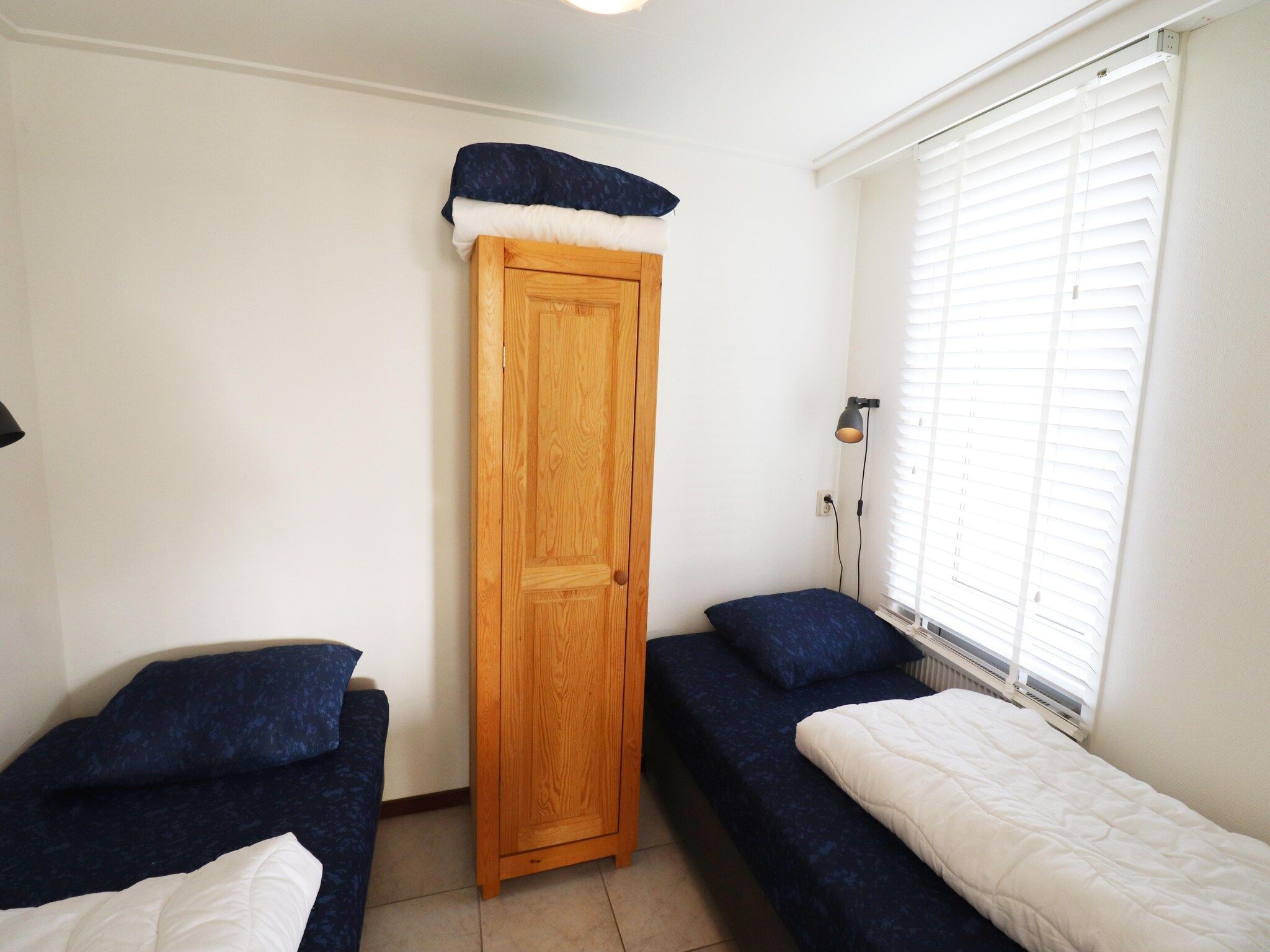 Een slaapkamer van Golfvilla 38 comfort in Hollum