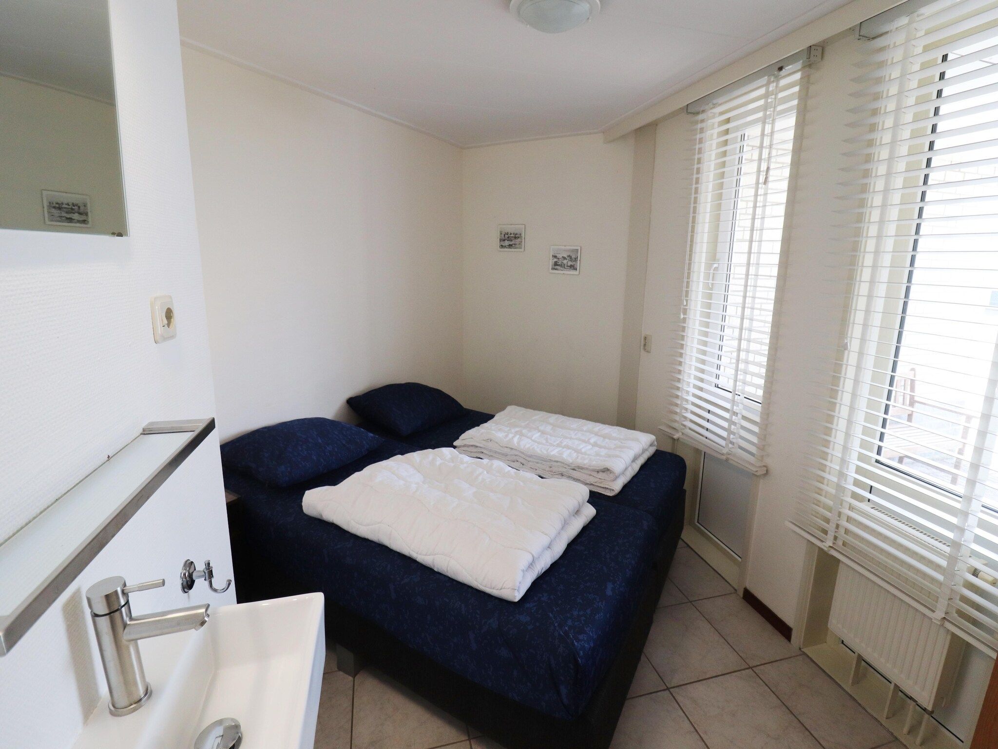 Een slaapkamer van Golfvilla 38 comfort in Hollum