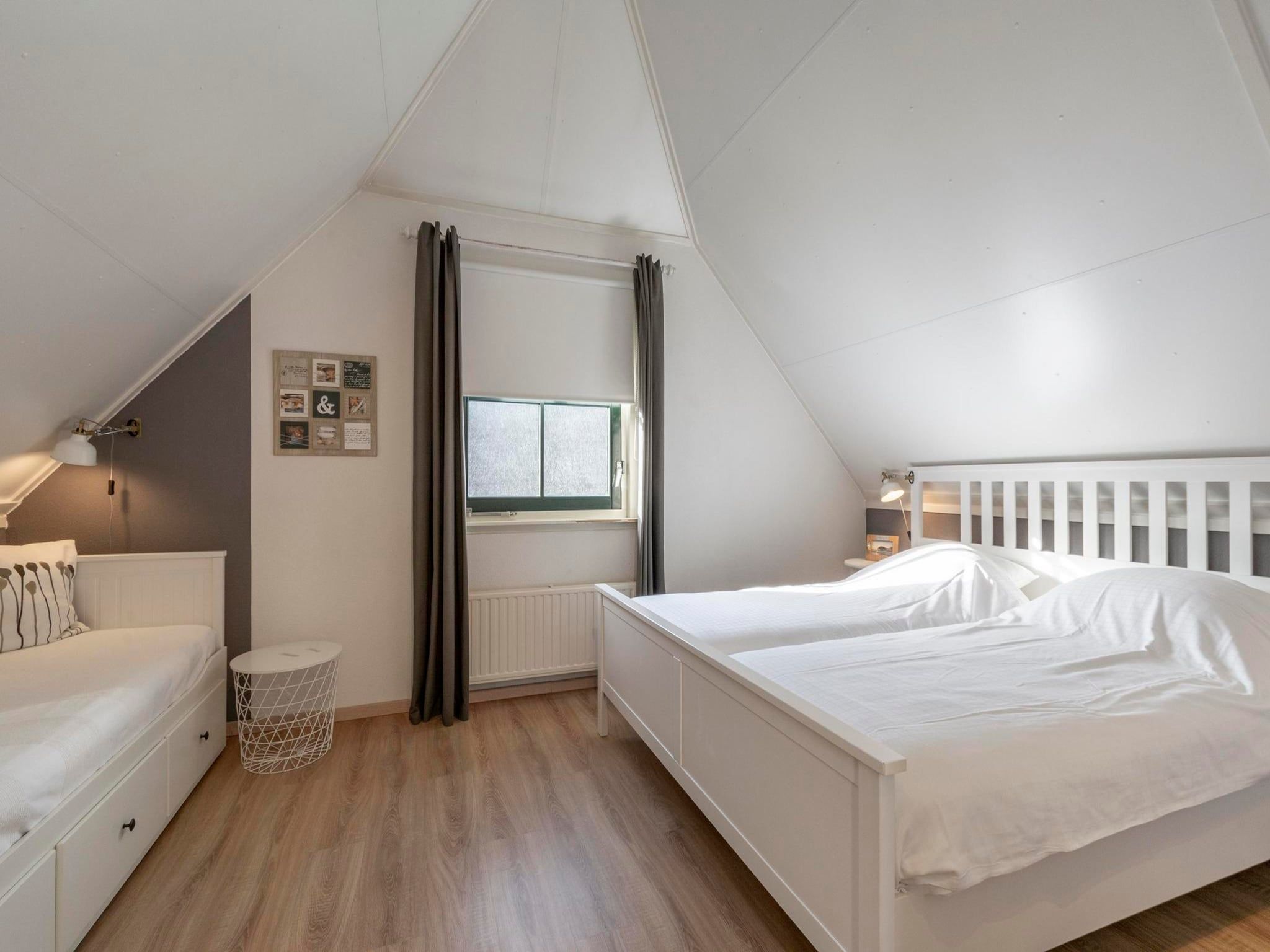 Een slaapkamer van Buitenplaats 27 - Callantsoog in Callantsoog
