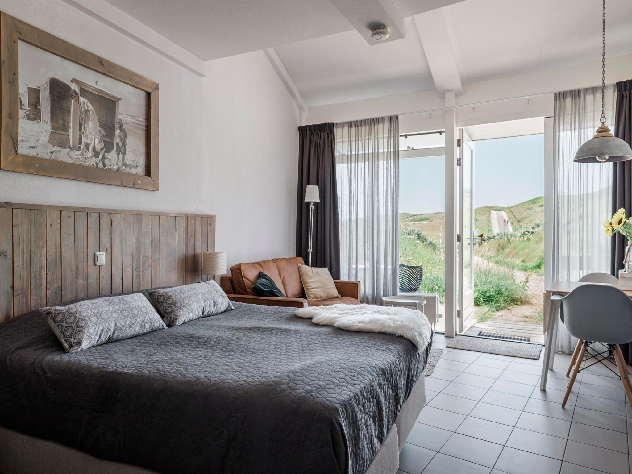 Een slaapkamer van Duynsuites aan zee in Callantsoog