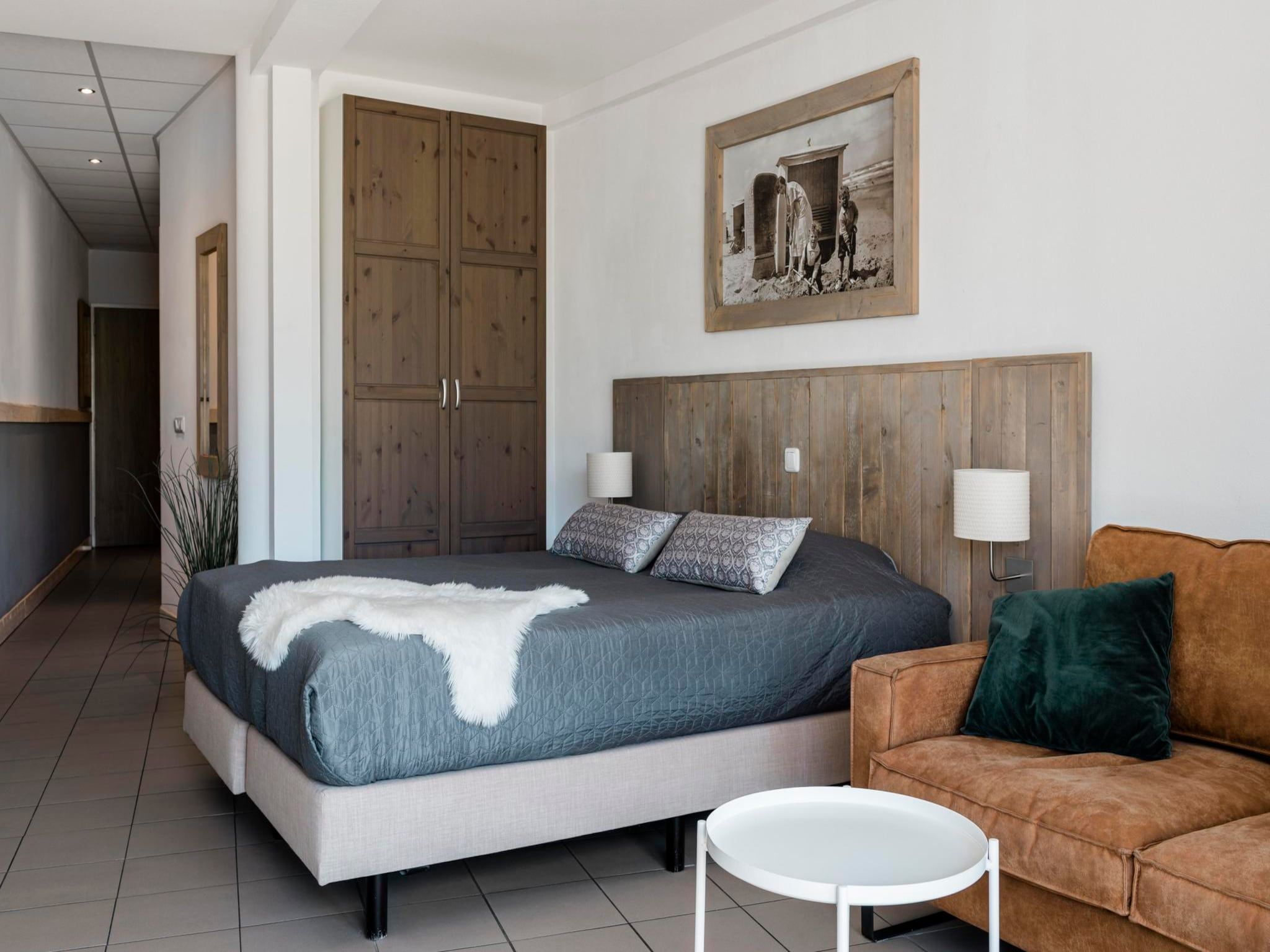 Een slaapkamer van Duynsuites aan zee in Callantsoog