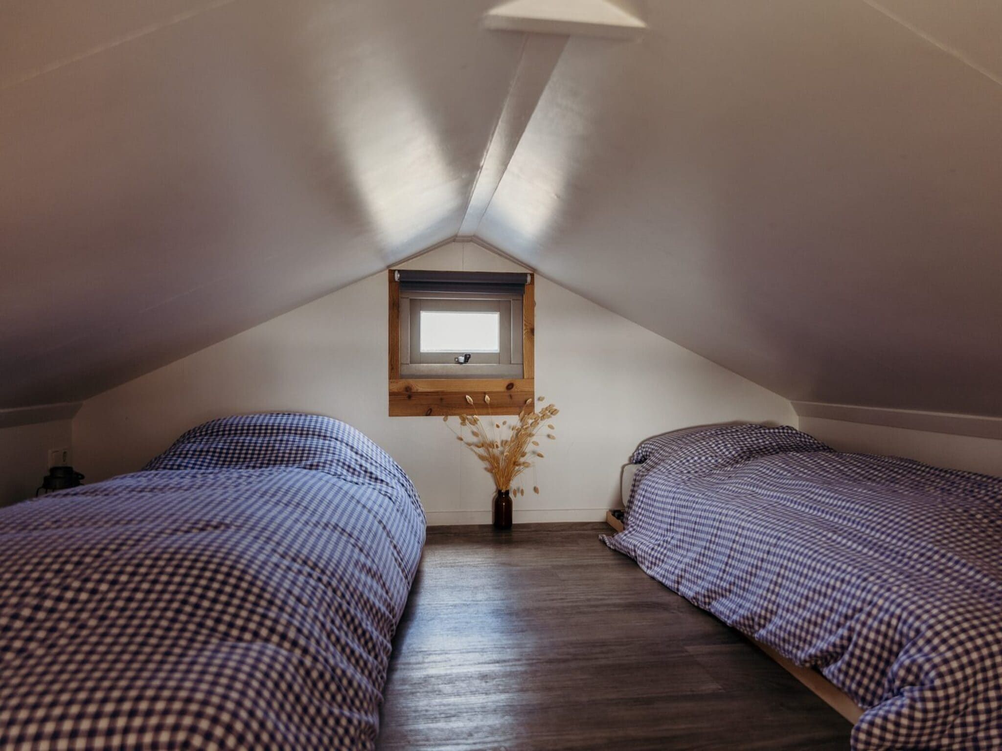 Een slaapkamer van Reddingshuisje - Duynpark in Callantsoog