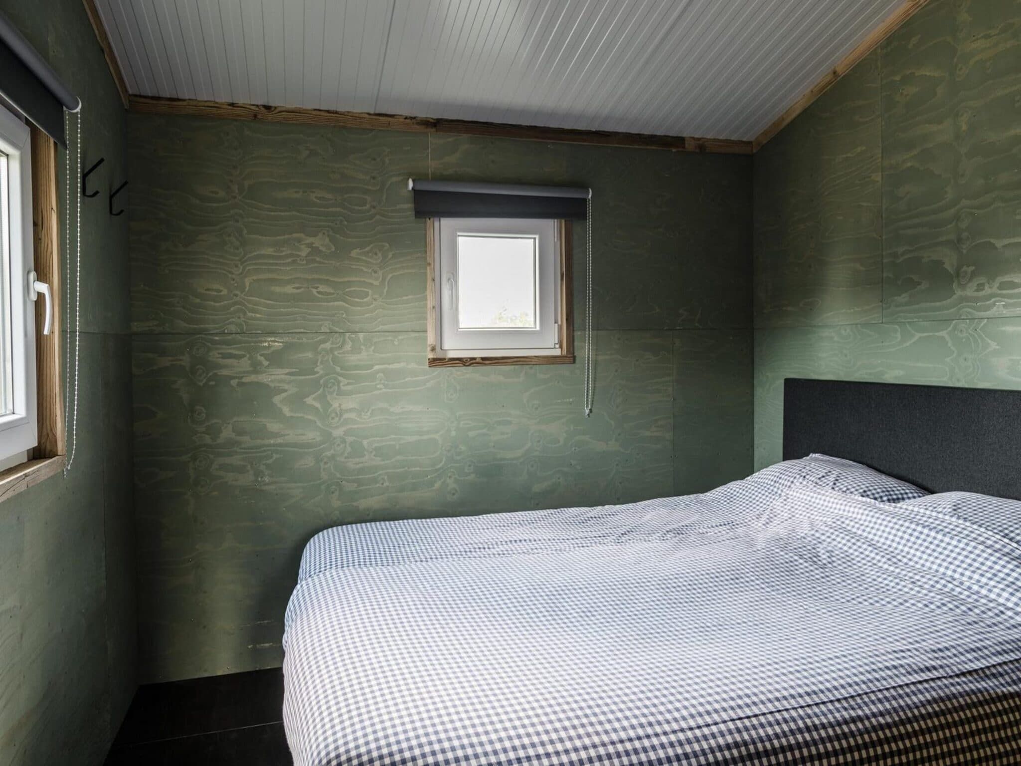 Een slaapkamer van Reddingshuisje - Duynpark in Callantsoog