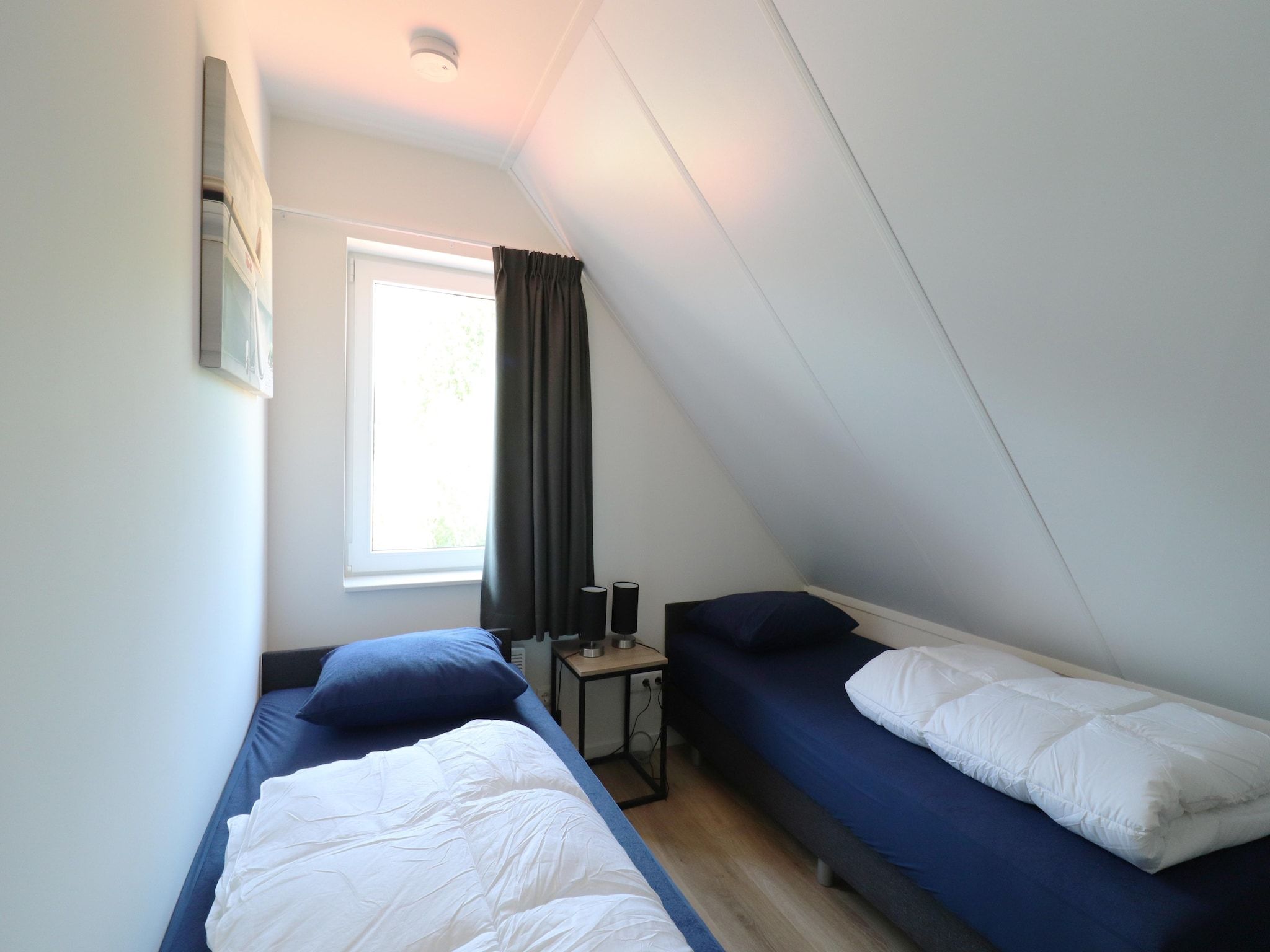 Een slaapkamer van Kuifduiker 122 in Simonshaven