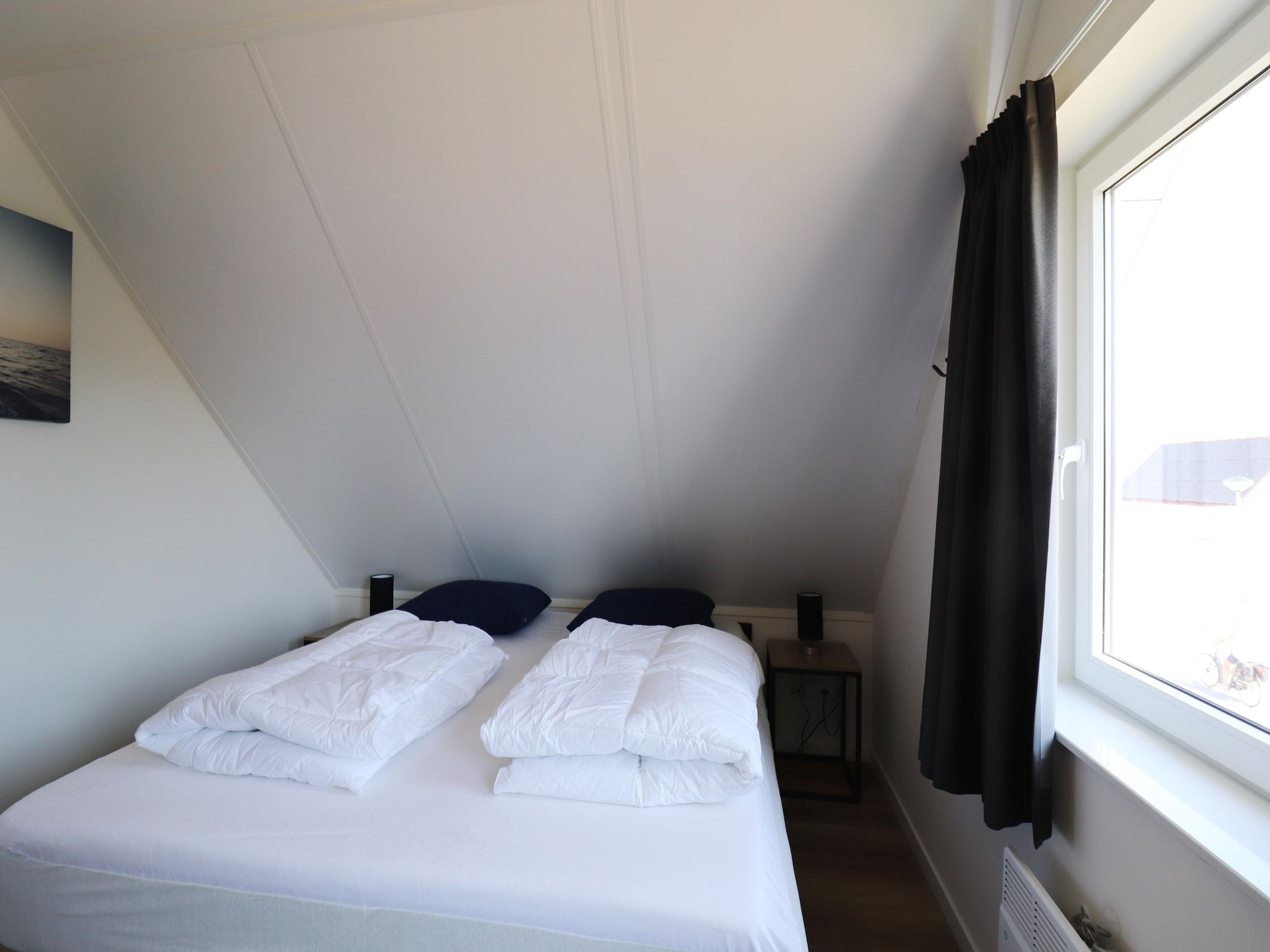 Een slaapkamer van Kuifduiker 122 in Simonshaven