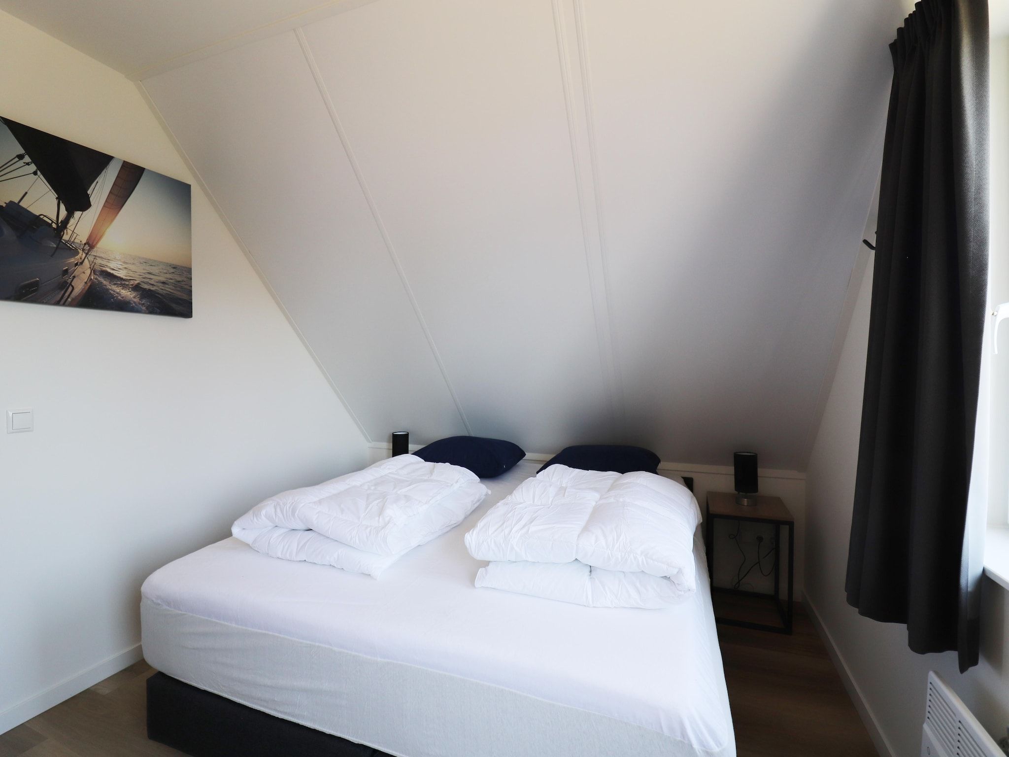 Een slaapkamer van Kuifduiker 122 in Simonshaven