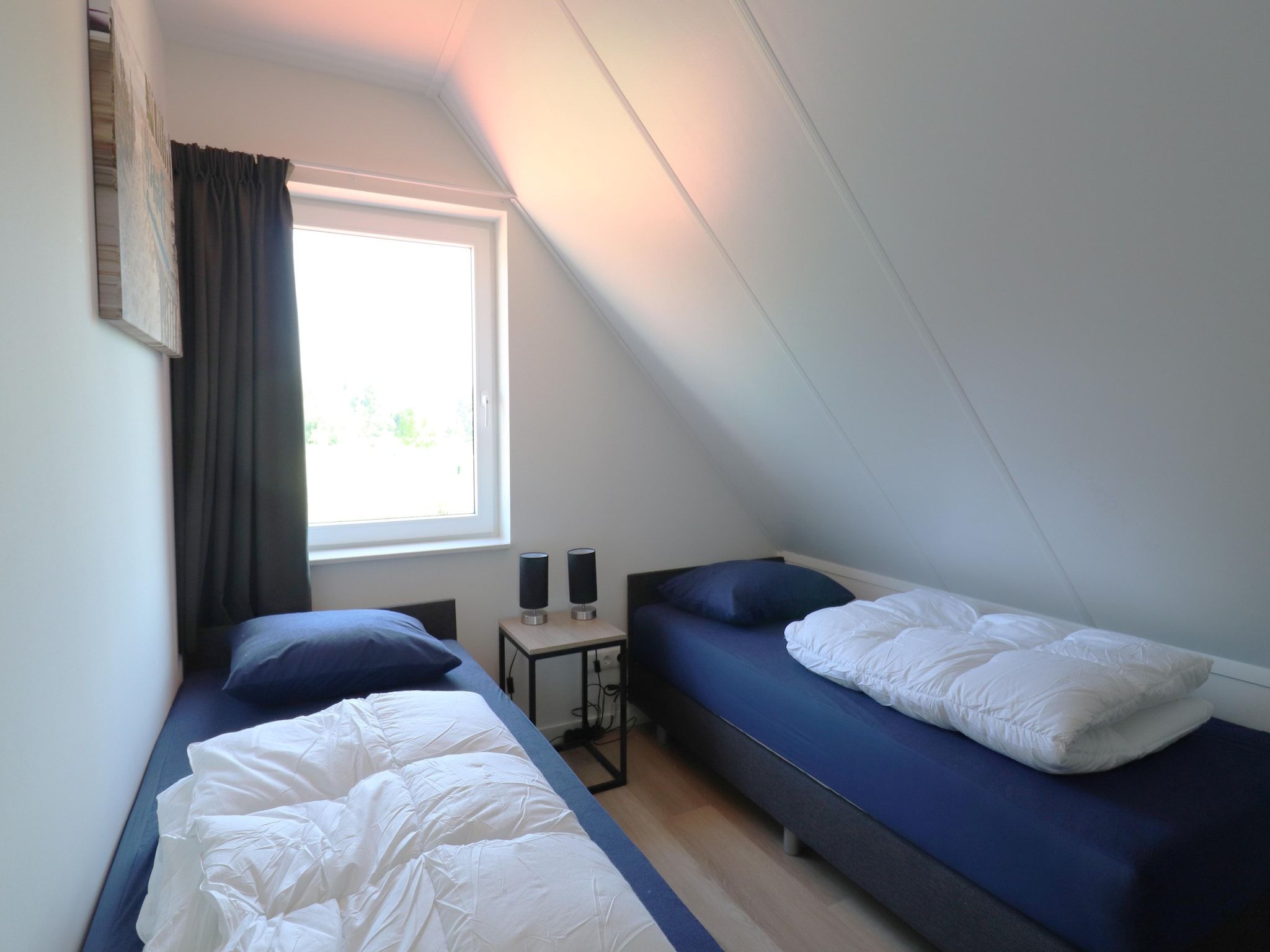Een slaapkamer van Kuifduiker 122 in Simonshaven