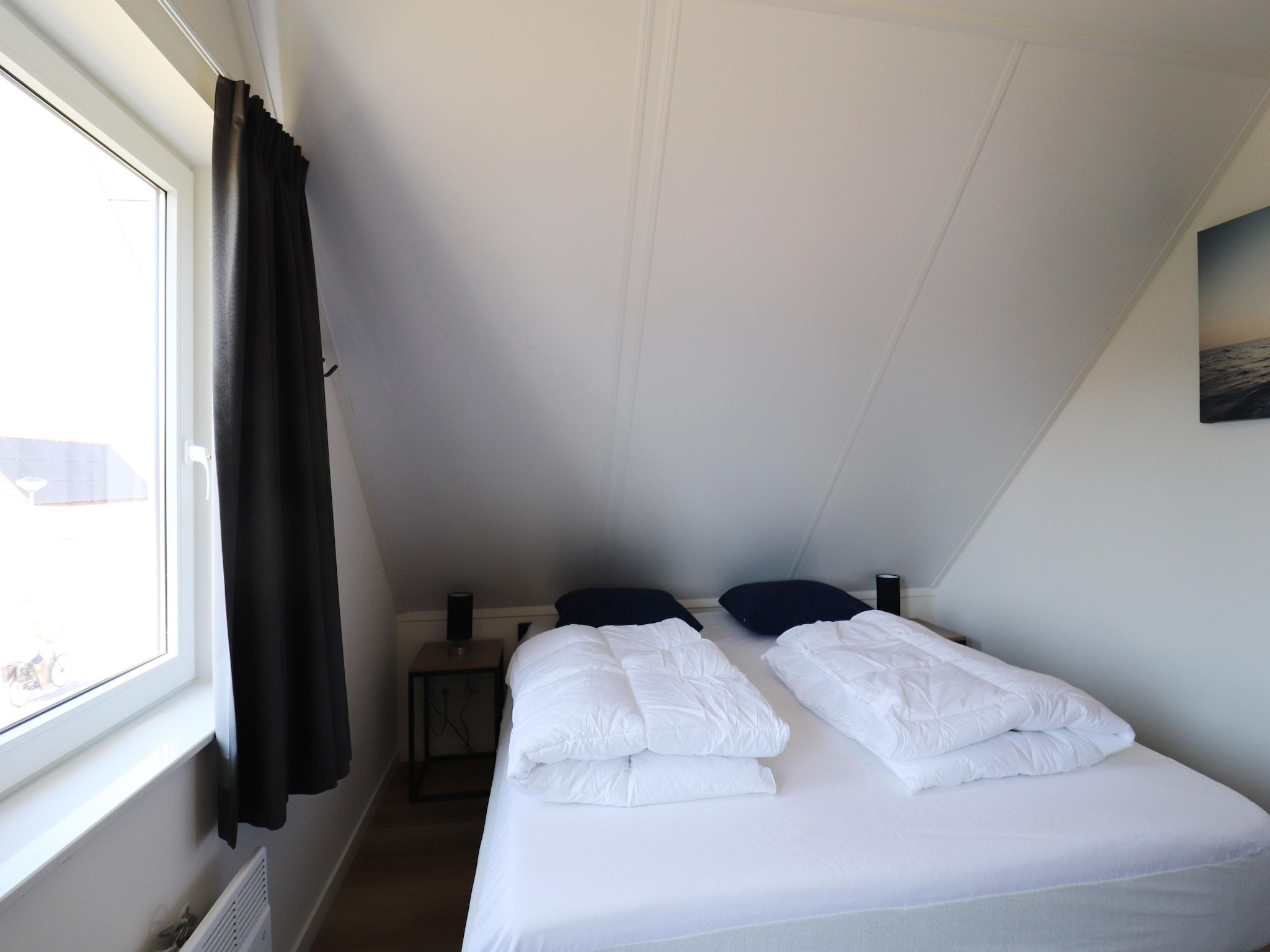 Een slaapkamer van Kuifduiker 122 in Simonshaven