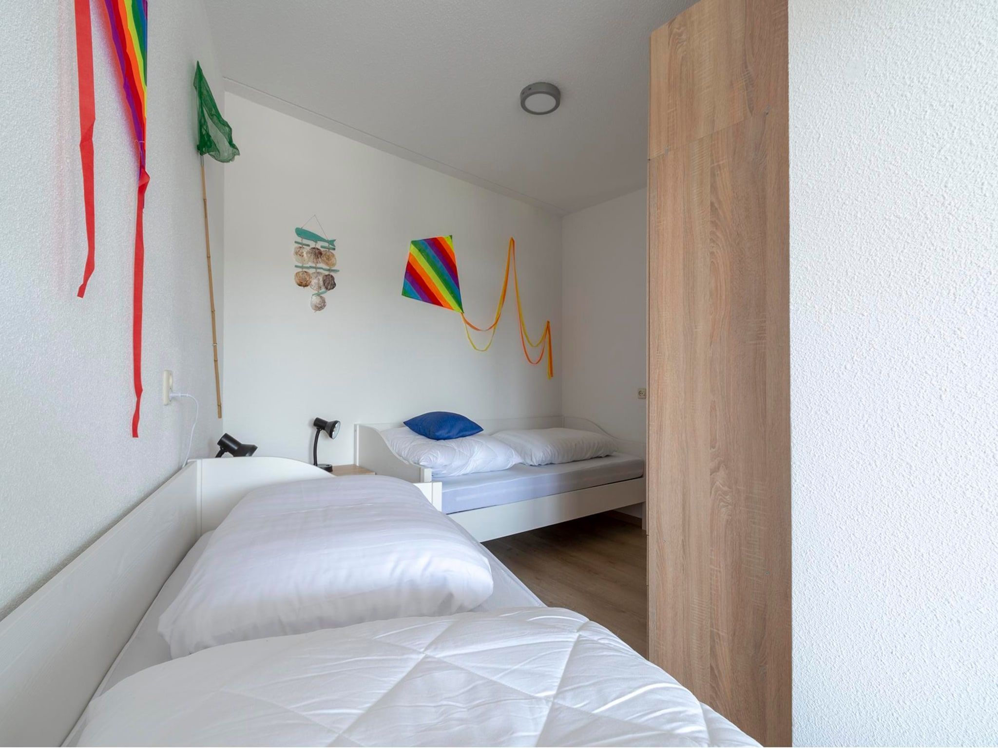 Een slaapkamer van Résidence Juliana 53 in Julianadorp aan Zee