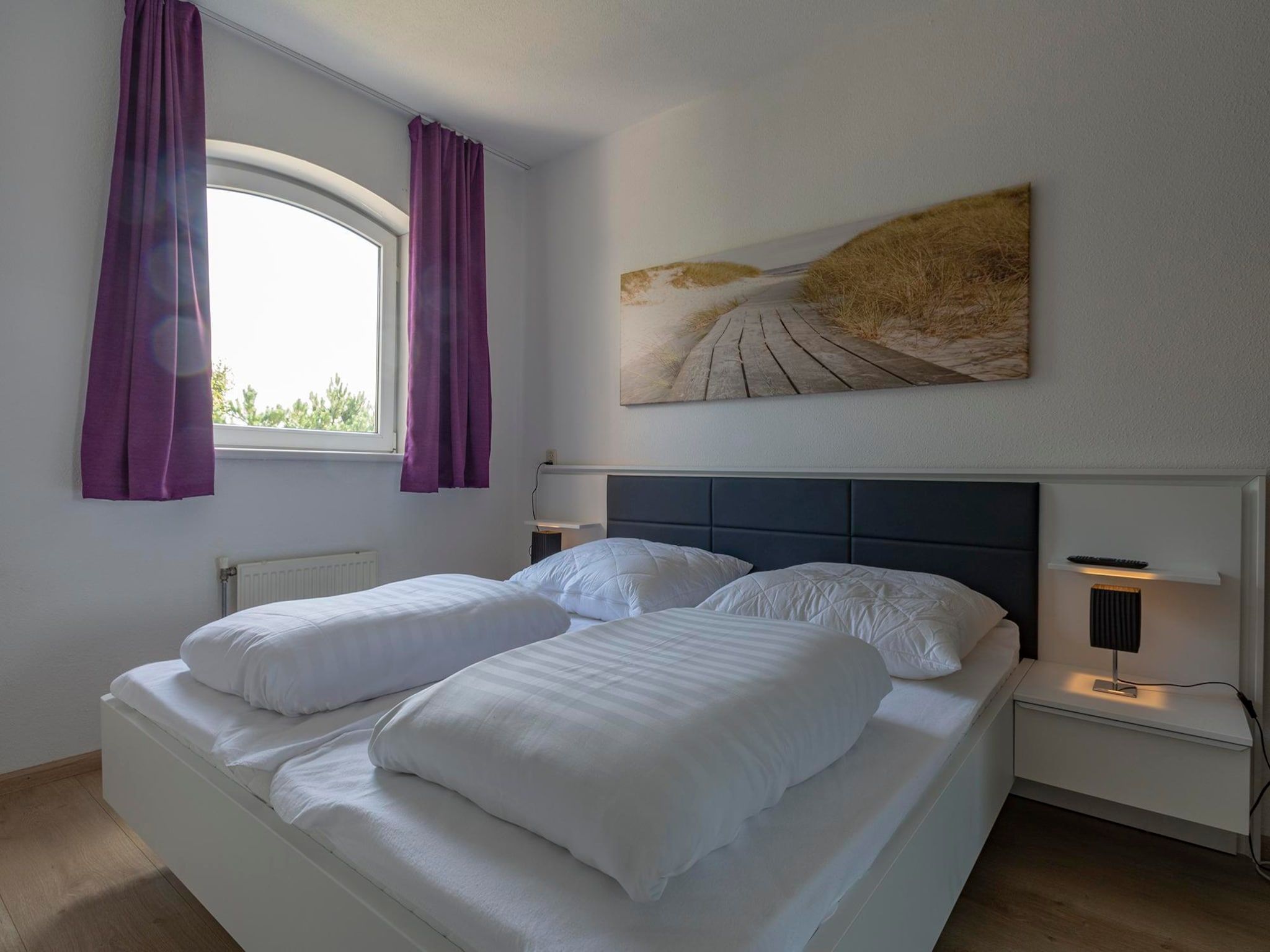 Een slaapkamer van Résidence Juliana 53 in Julianadorp aan Zee