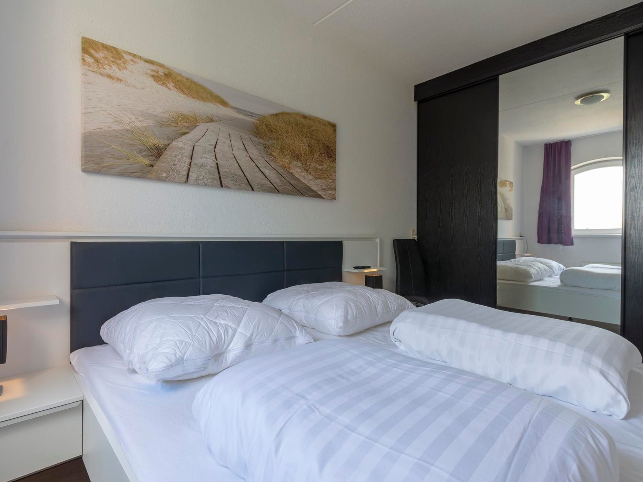 Een slaapkamer van Résidence Juliana 53 in Julianadorp aan Zee