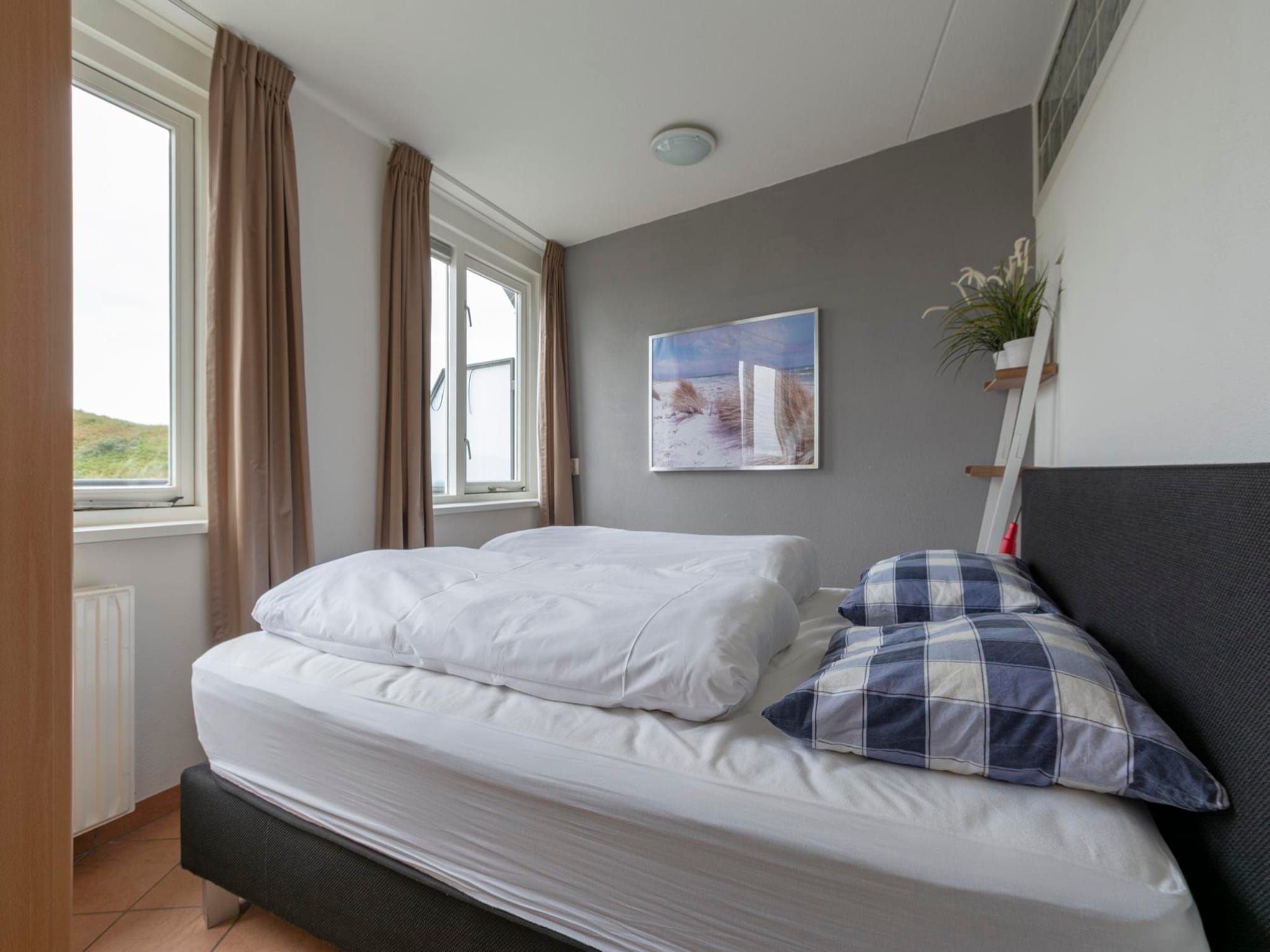 Een slaapkamer van Wijde Blick 307 in Callantsoog