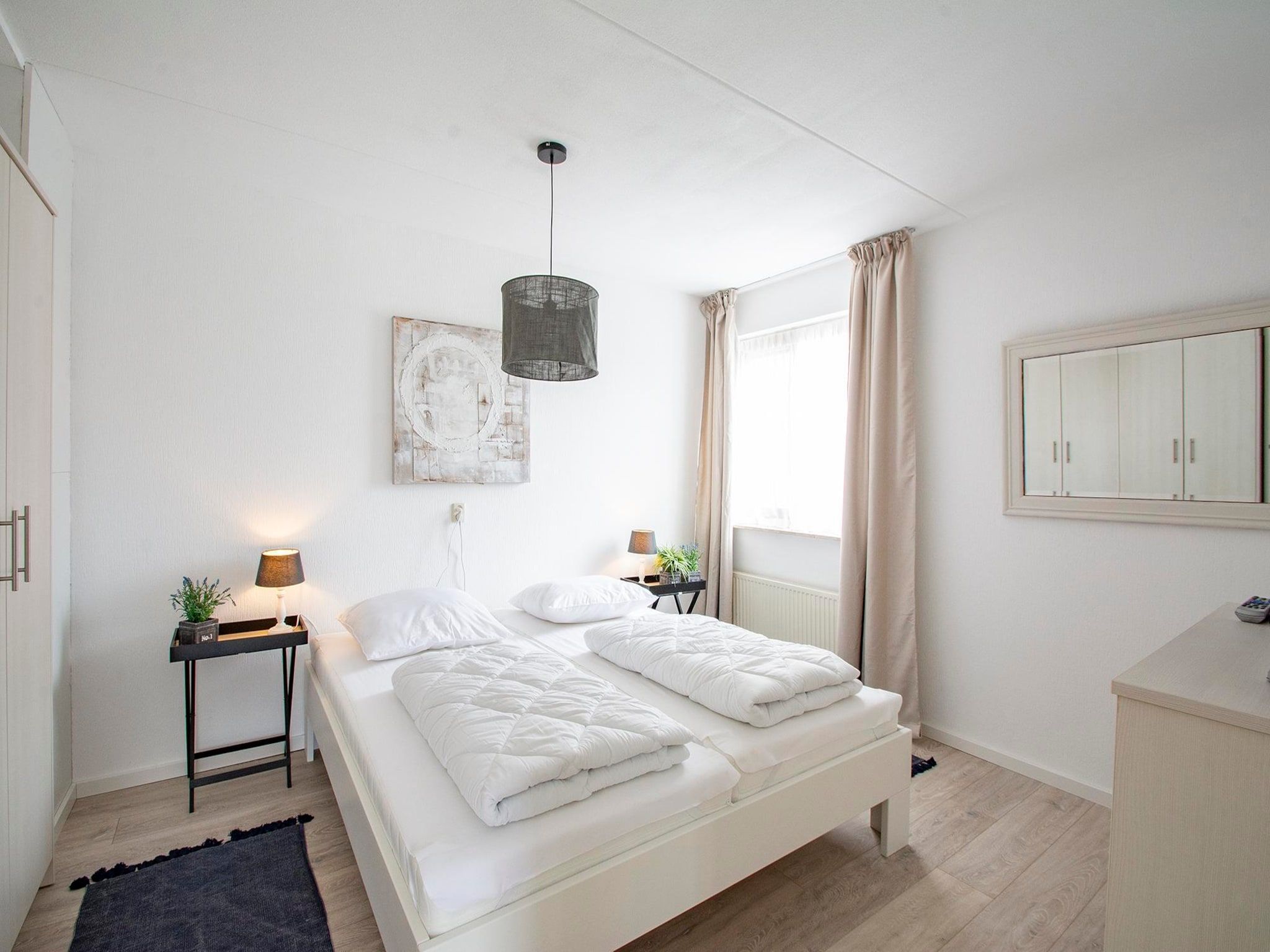 Een slaapkamer van Ooghduyne 187 in Julianadorp aan Zee
