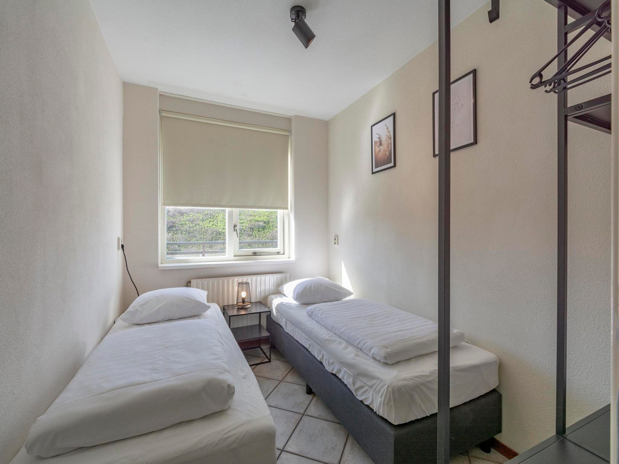 Een slaapkamer van Wijde Blick 309 in Callantsoog